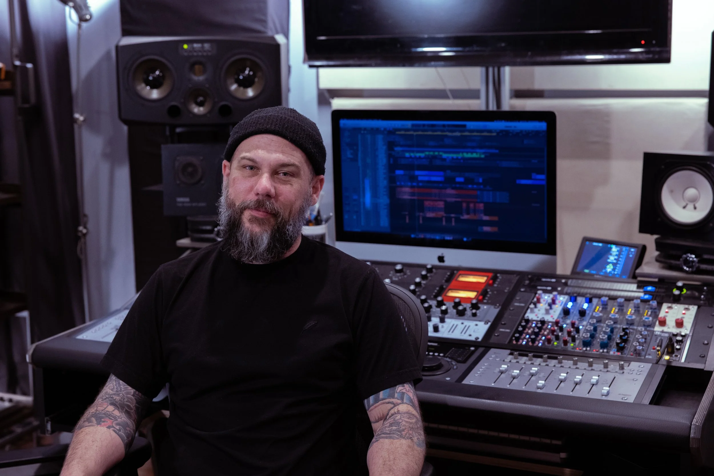Kevin Friedrichsen, Owner and head engineer at Golden Palm Recorders. Analog recording equipment is behind him in a well treated room.