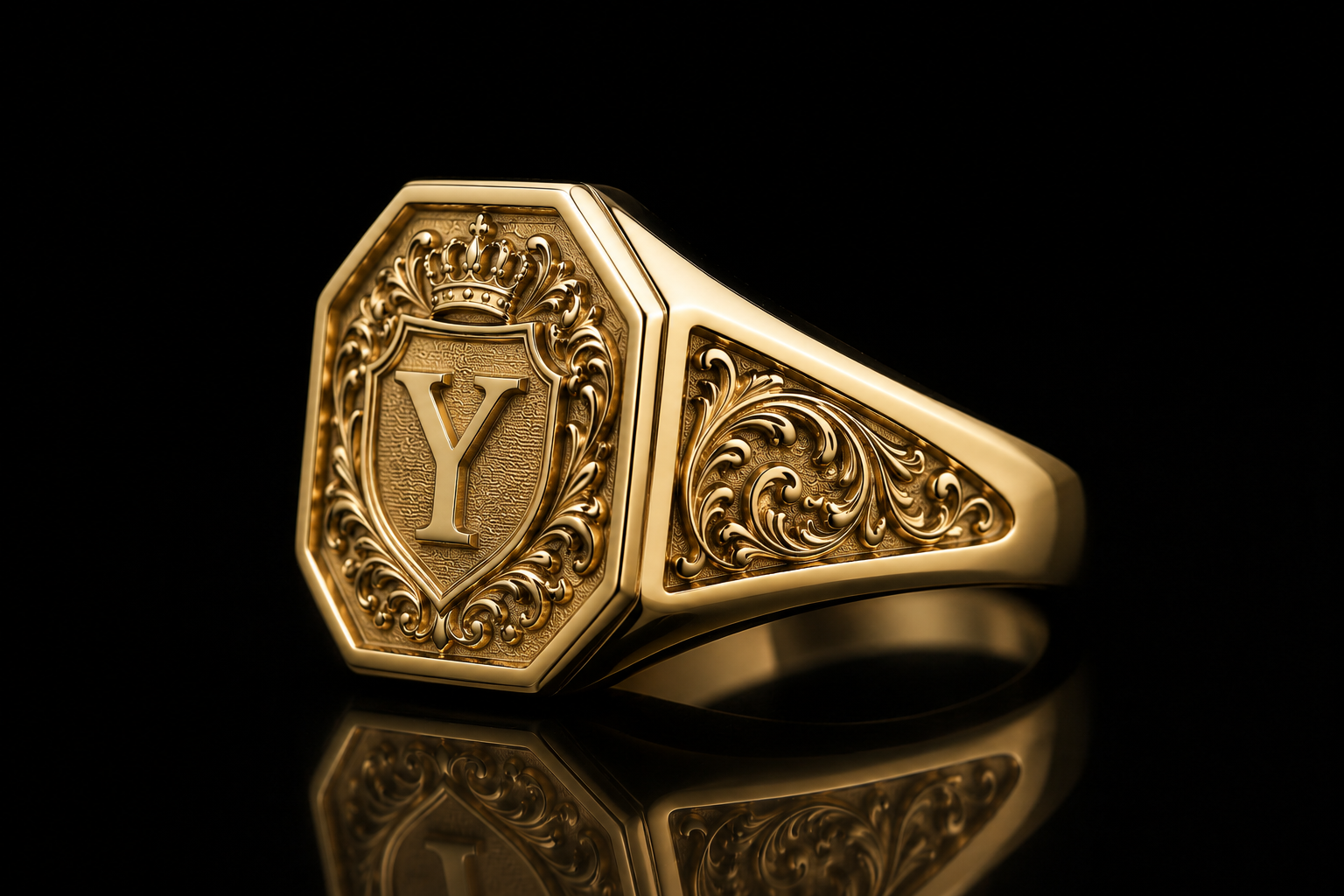 A gold ring with an ornate crest featuring a crown and the letter Y in the center, set against a black background.