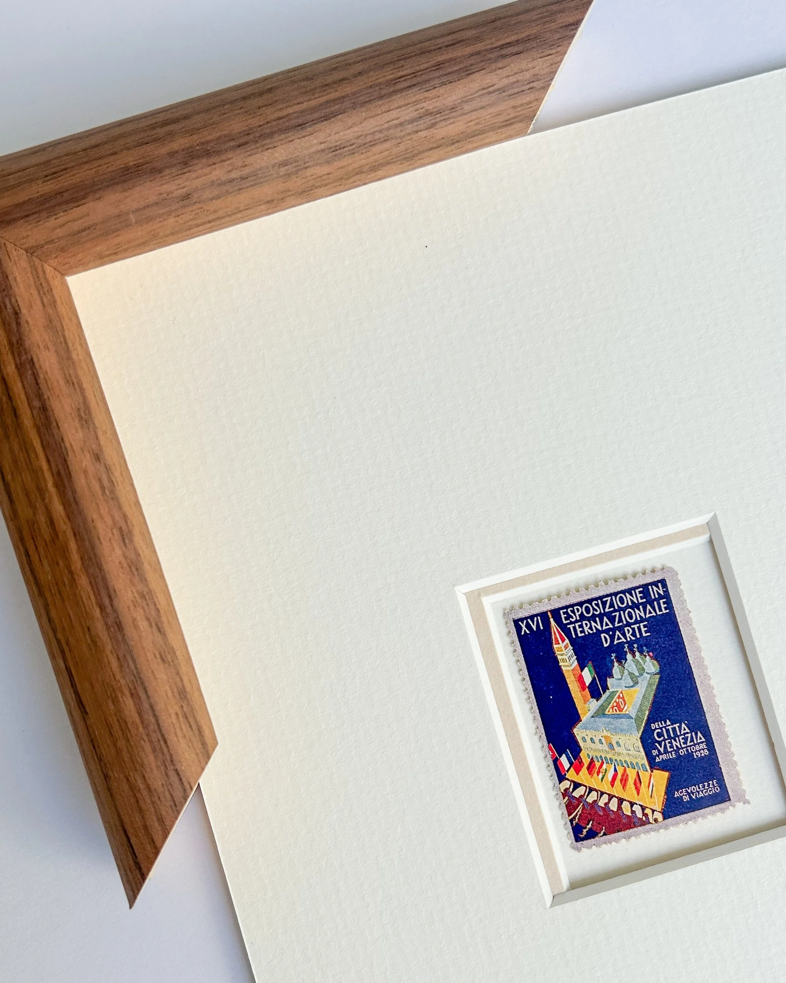 A poster stamp for the 16th Venice Biennale - an Art Deco aerial view of Piazza San Marco, the Campanile, the Doge&rsquo;s Palace, and the Basilica, with gondolas and national flags lining the water. Issued nearly a century ago.

This stamp from 1928