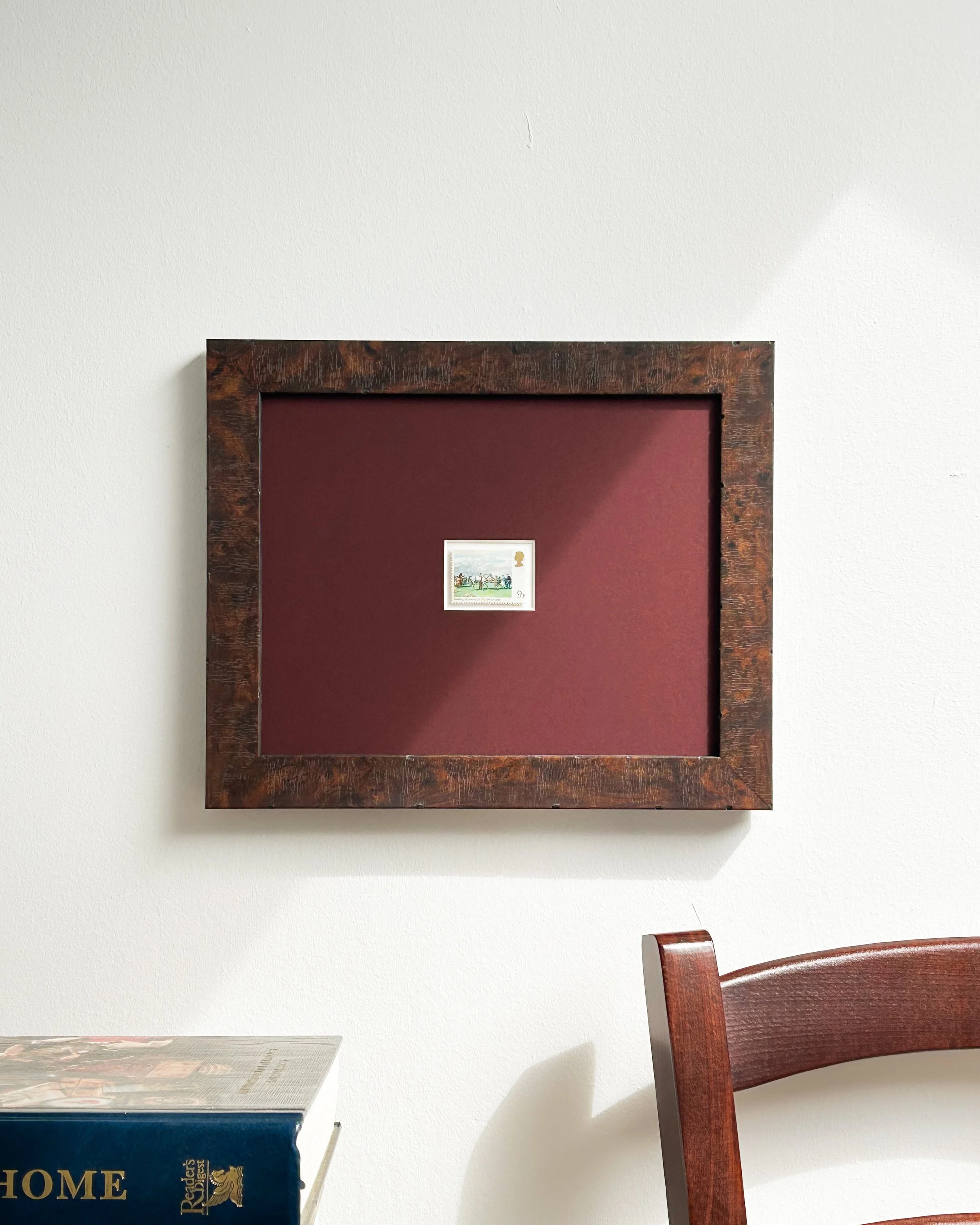 saddling-mahmoud-horse-racing-stamp-framed-on-wall-with-chair.jpg