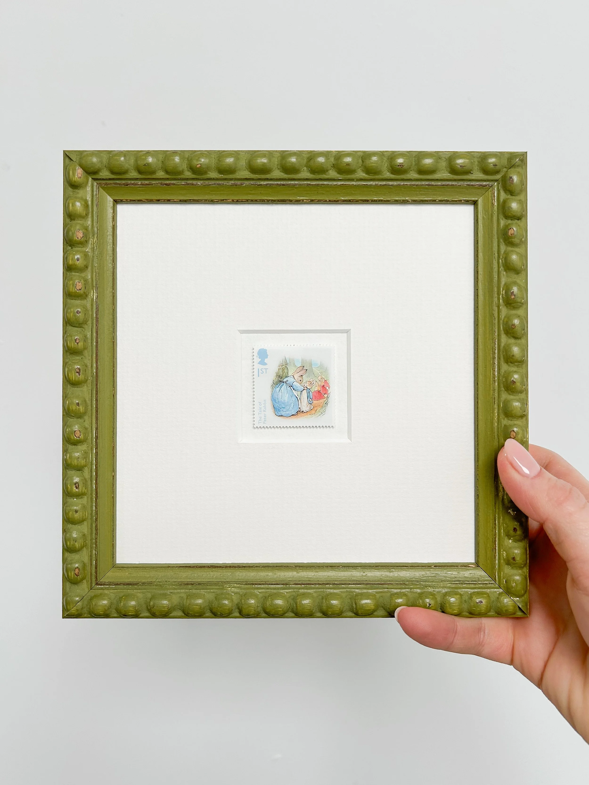 mrs-rabbit-buttoning-peters-coat-framed-stamp-withhand.jpg