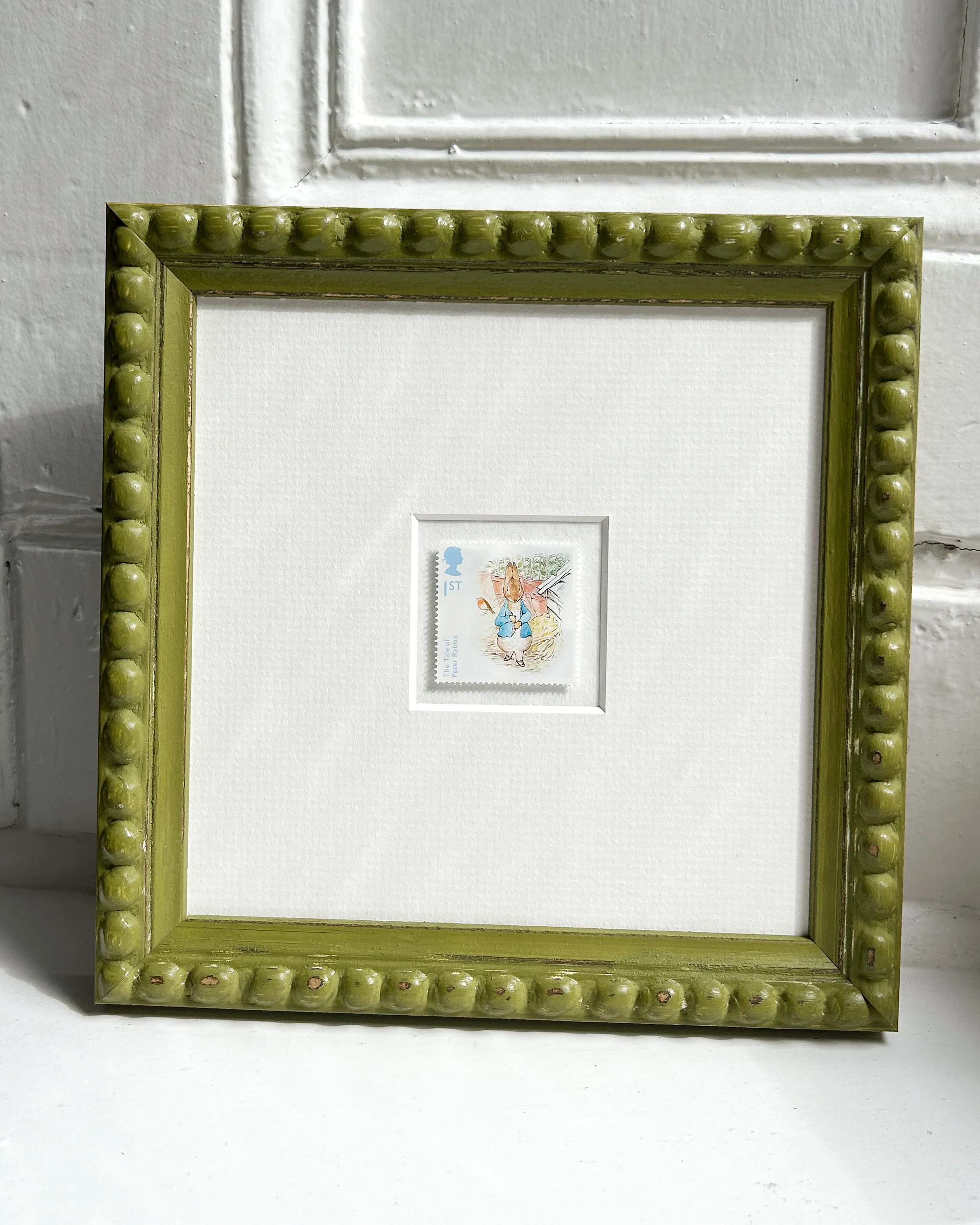 Peter-Rabbit-in-the-garden-onwindowsill.jpg
