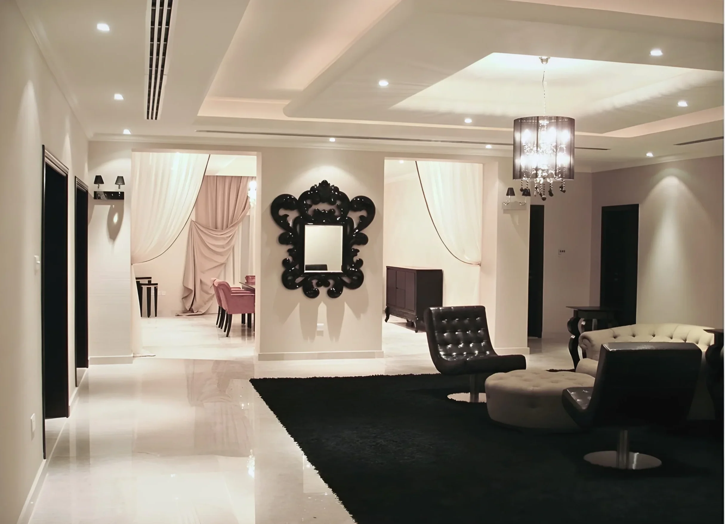 Luxury villa interior design in Sharjah with open living space, statement lighting, and neutral palette