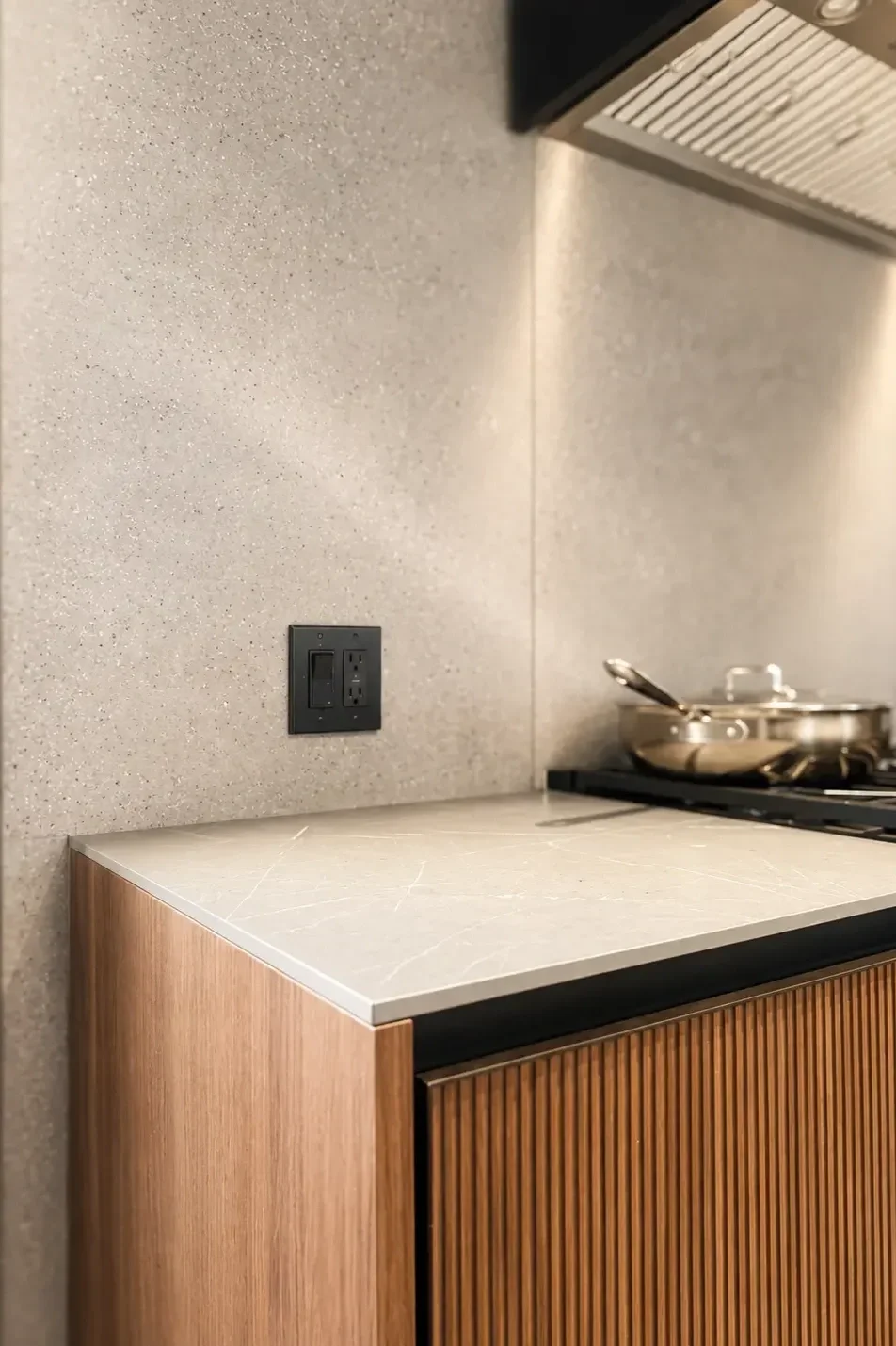 Elle groove kitchen detail with ribbed wood cabinetry and stone countertop in Franklin Lakes New Jersey.
