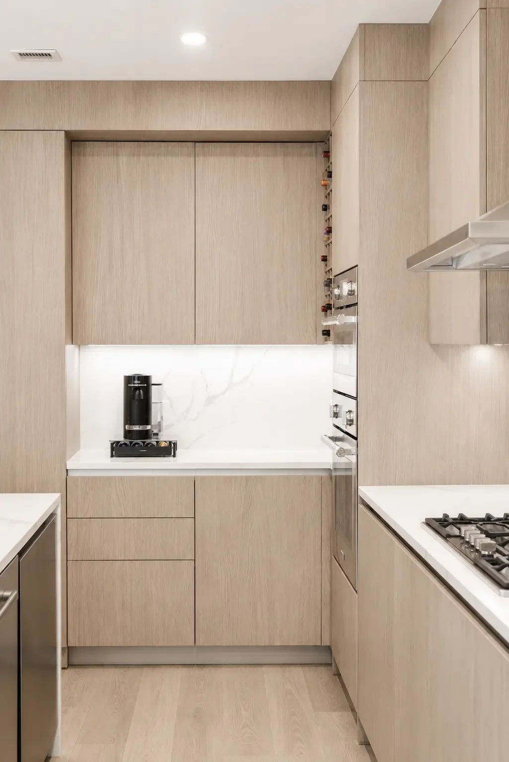 Front view of a modern kitchen in Woodland Park NJ with quartz island and custom cabinetry.