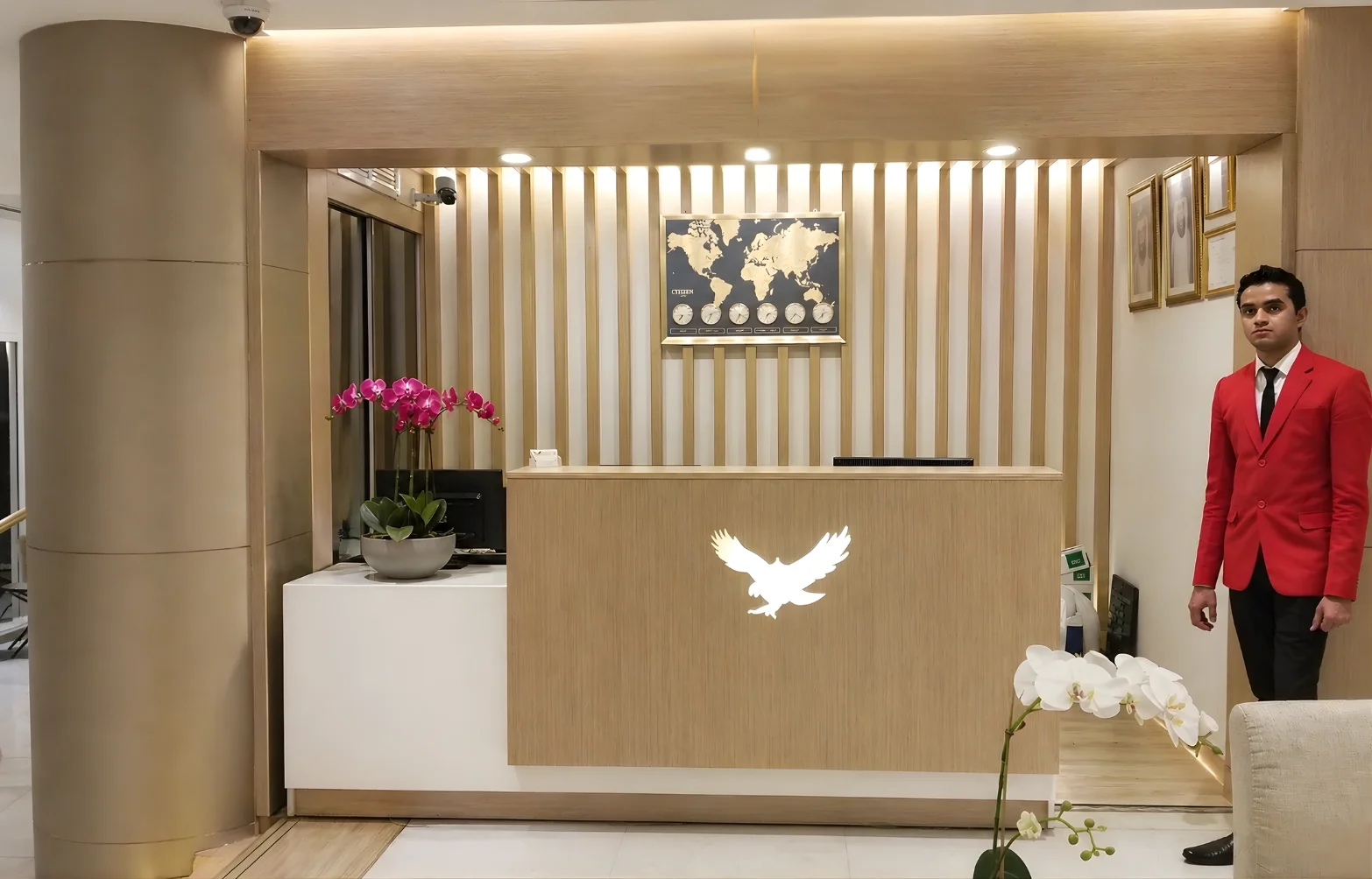 Modern hotel reception design at Royal Falcon Hotel Bur Dubai with custom joinery, integrated lighting, and refined material palette