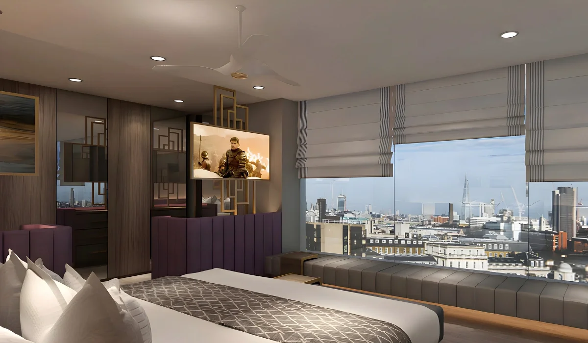 Contemporary bedroom with upholstered bed, soft neutral tones, and ambient lighting creating a calm and inviting space