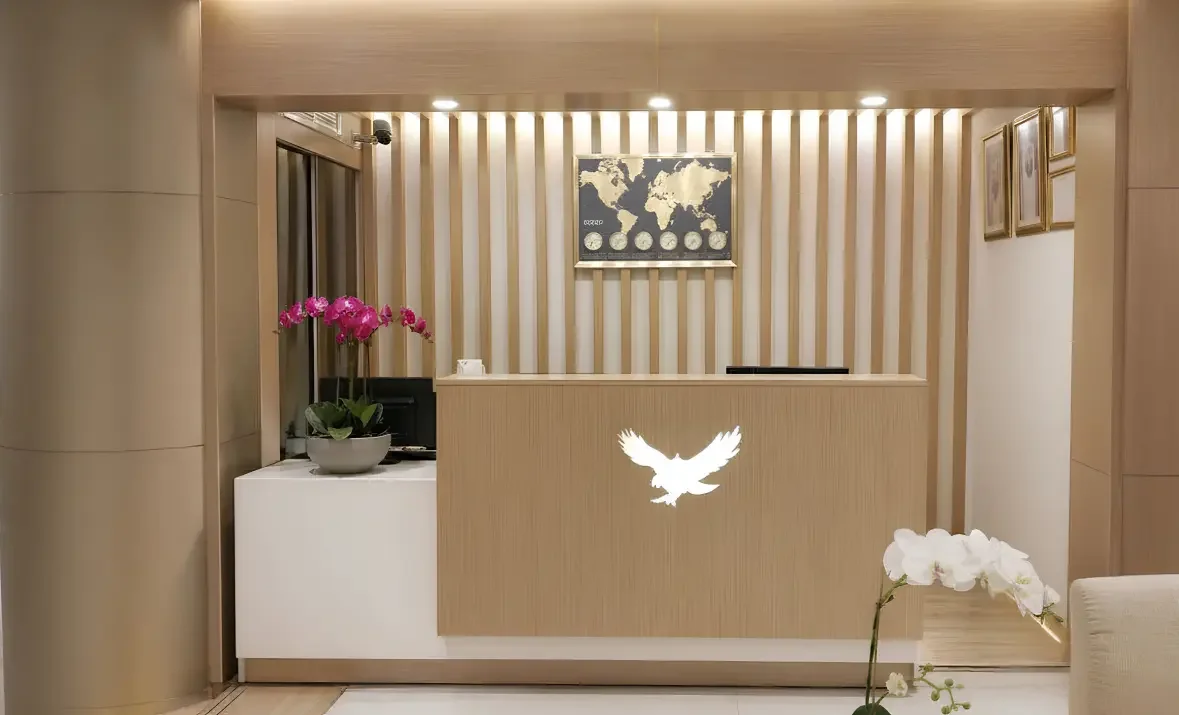 Modern hotel reception design at Royal Falcon Hotel Bur Dubai with custom joinery, integrated lighting, and refined material palette