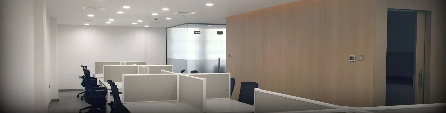 Modern office workstation design for Shurooq Sharjah with open layout, glass partitions, and efficient workspace planning