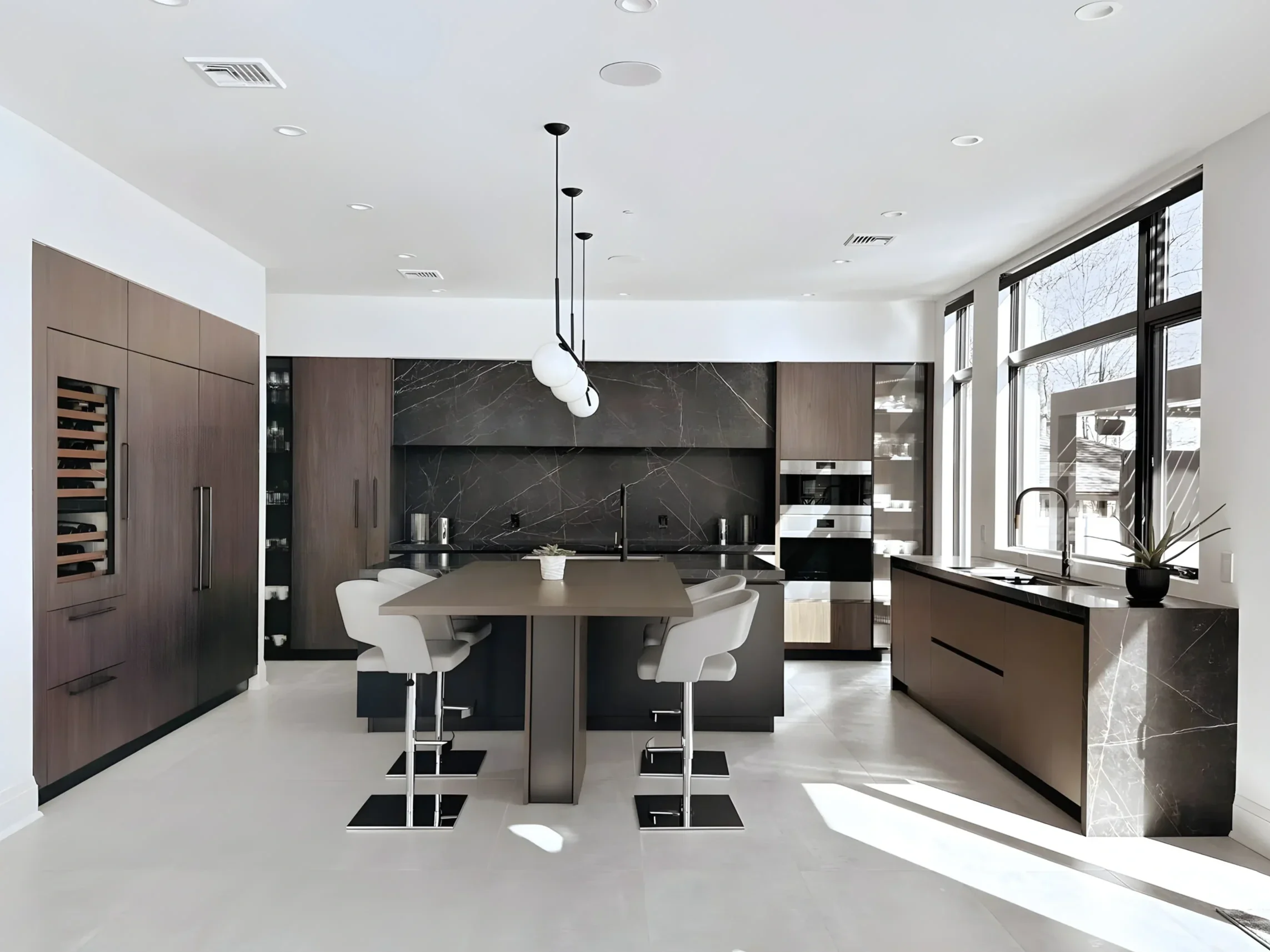 contemporary kitchen showing dark walnut cabinets paired with black marble with white veining.