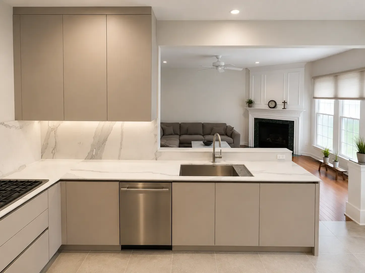 Open-plan kitchen in Pine CT New Jersey with integrated appliances and marble backsplash.
