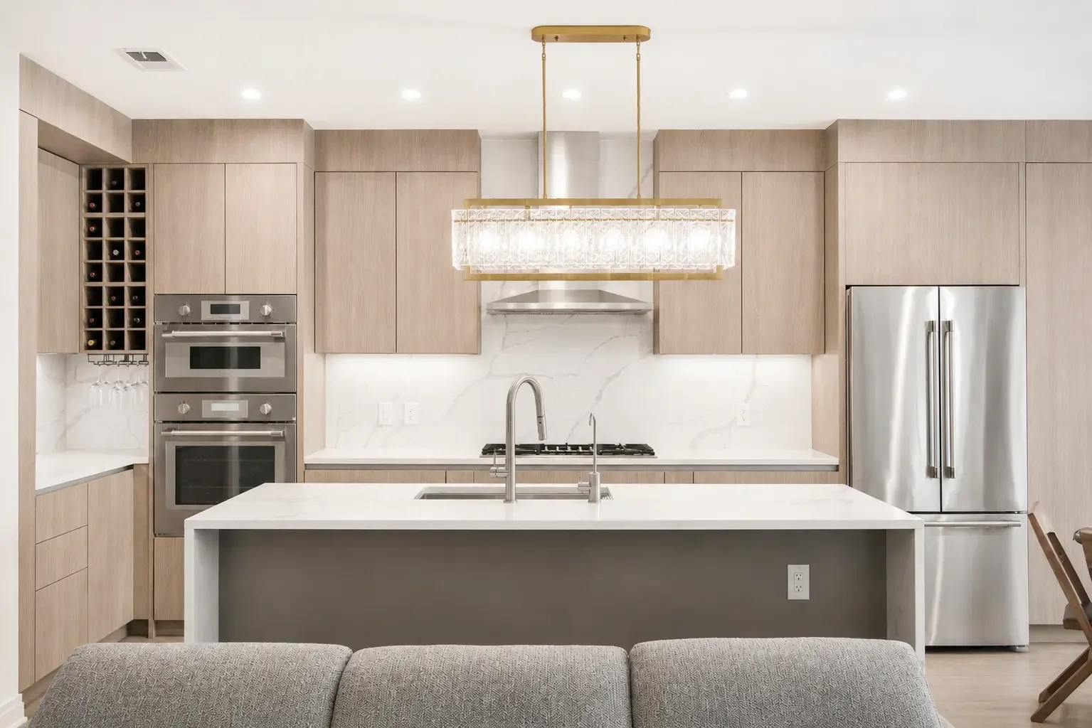 Modern transitional kitchen in Woodland Park NJ with stainless steel appliances and warm neutral finishes.