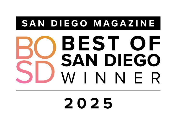 San Diego Magazine logo with stylized pink and orange wave design.