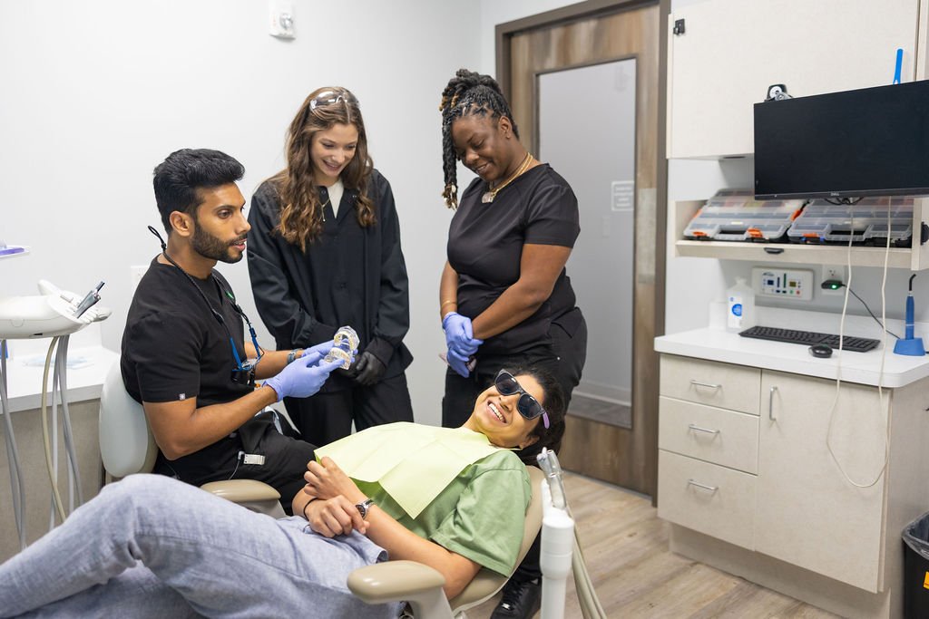 dental team with patient in treatment room Fox Point Dental Studio friendly dentist experience near Bayside Shorewood Glendale Wisconsin