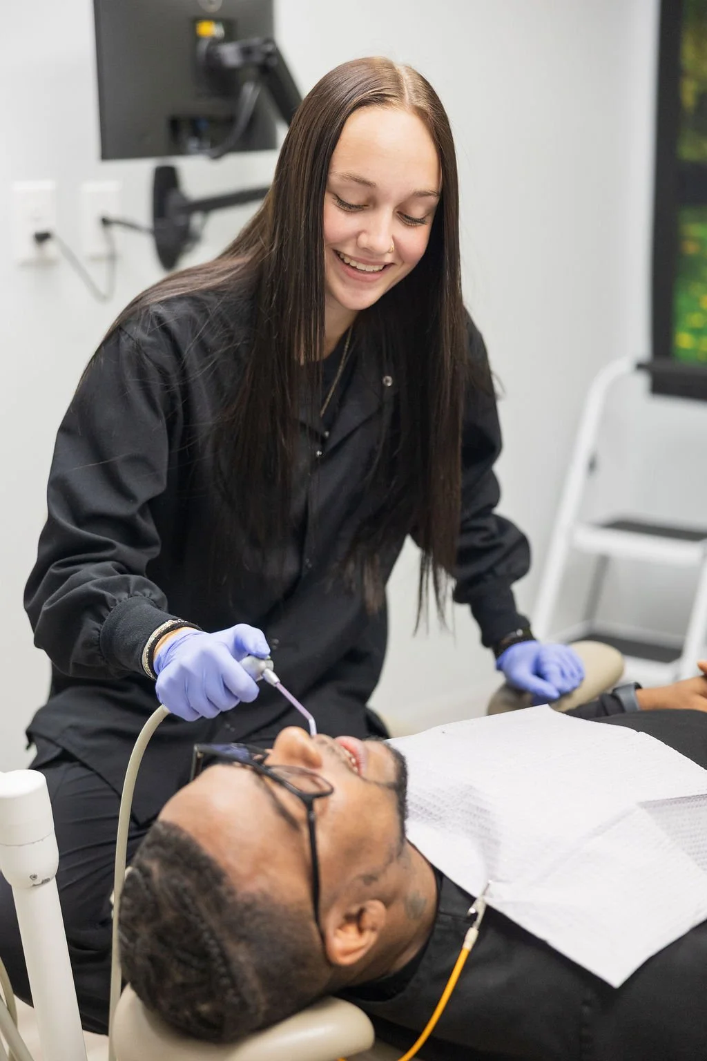 professional dental cleaning hygienist performing teeth cleaning Fox Point Wisconsin preventive dentistry near Bayside Shorewood Glendale