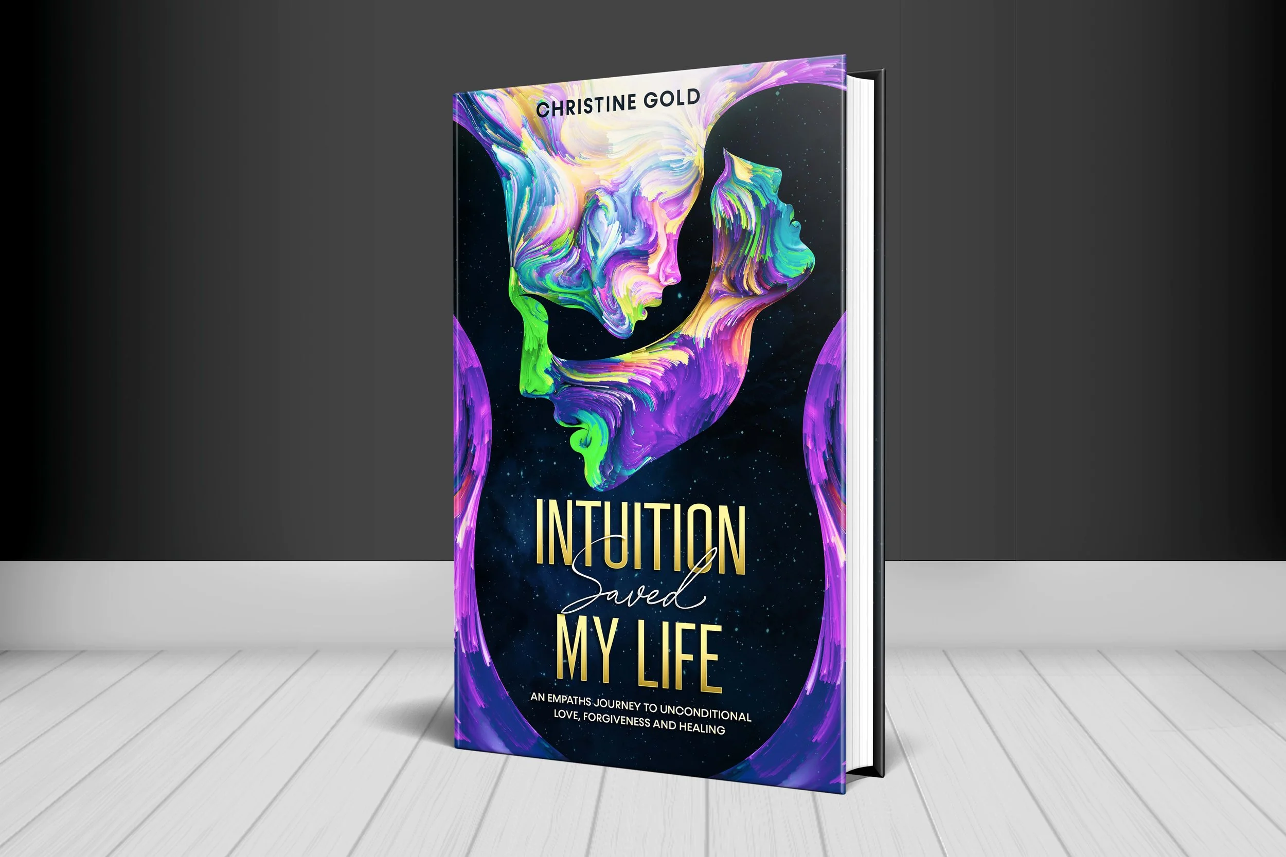Book cover titled "Intuition Saved My Life" by Christine Gold, featuring colorful abstract artwork of human faces against a starry background.