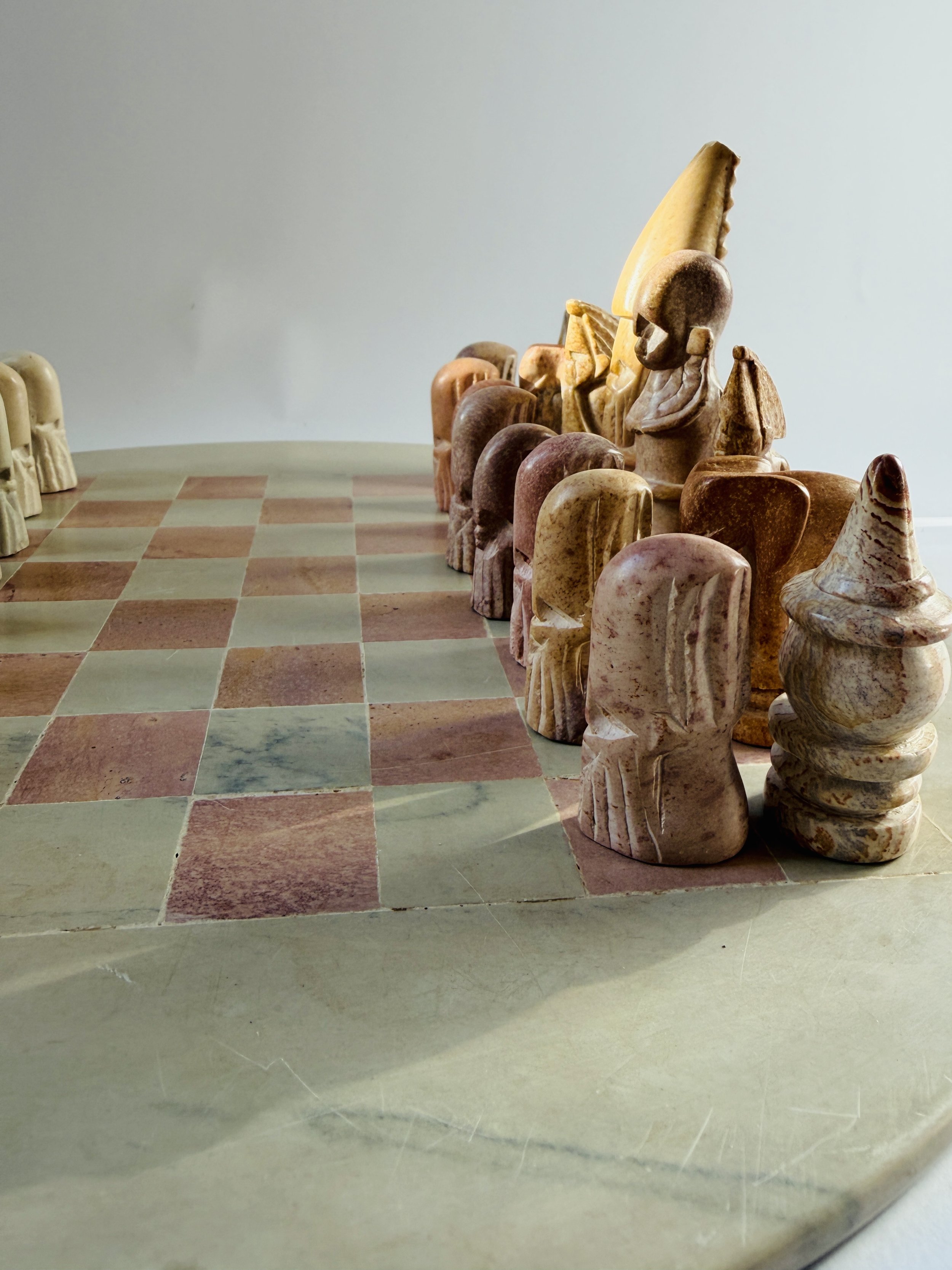 hand carved soapstone chess set with stone board and sculptural pieces