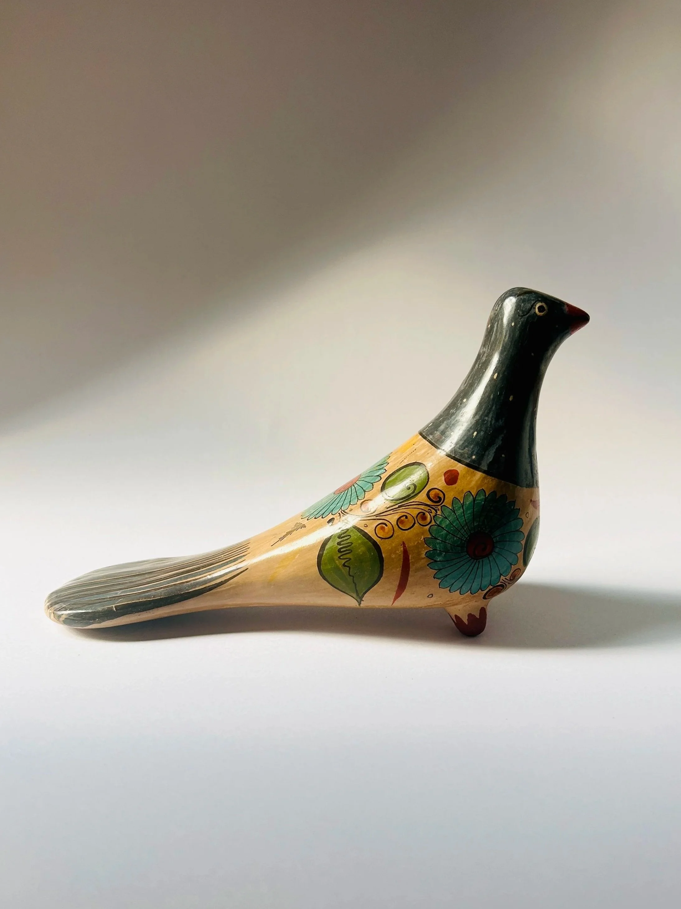Vintage hand-painted ceramic bird figurine with Mexican floral folk art design, decorative Tonala dove sculpture