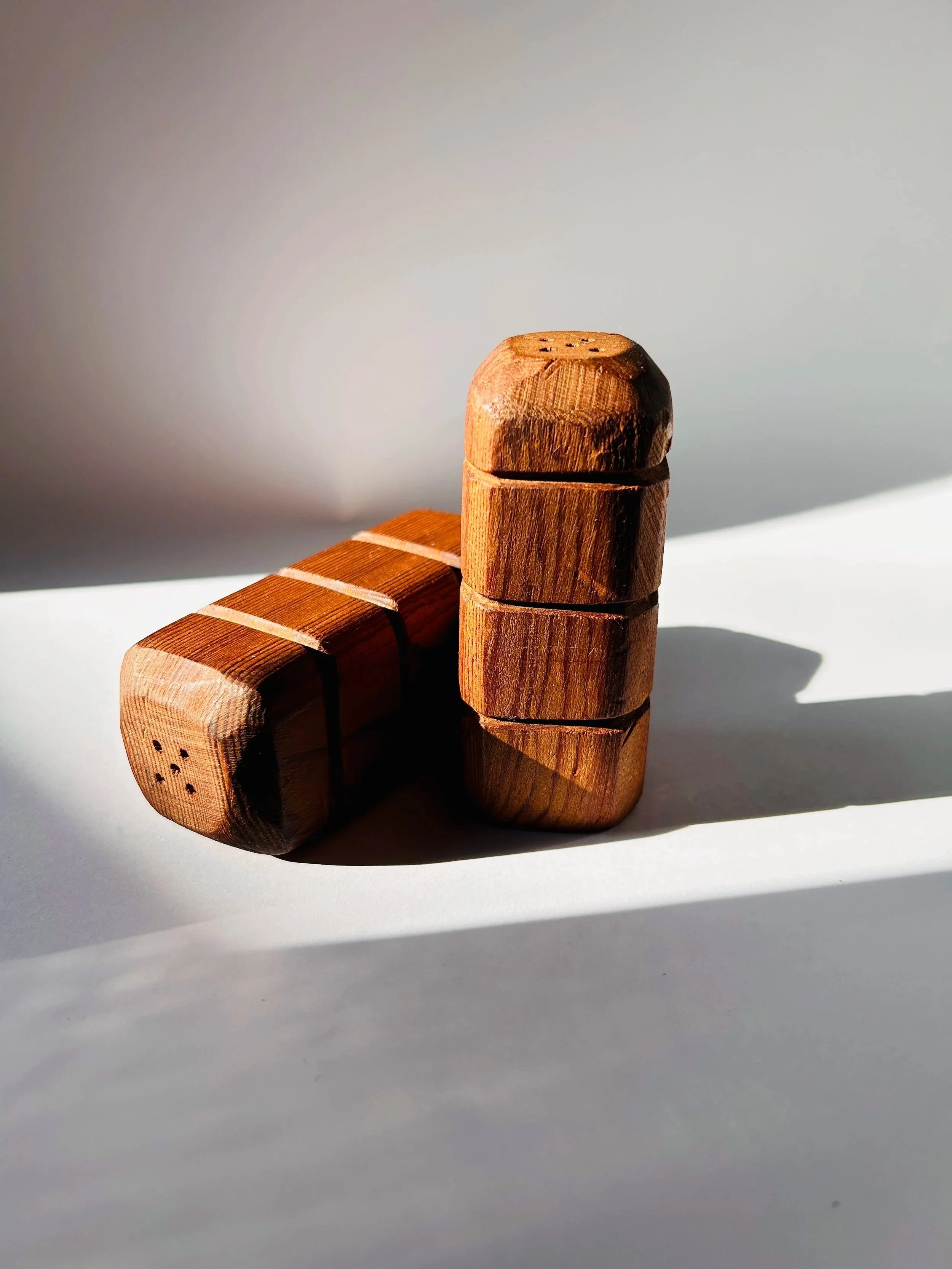Danish teak salt and pepper shakers with stacked geometric design, mid century modern wooden spice set