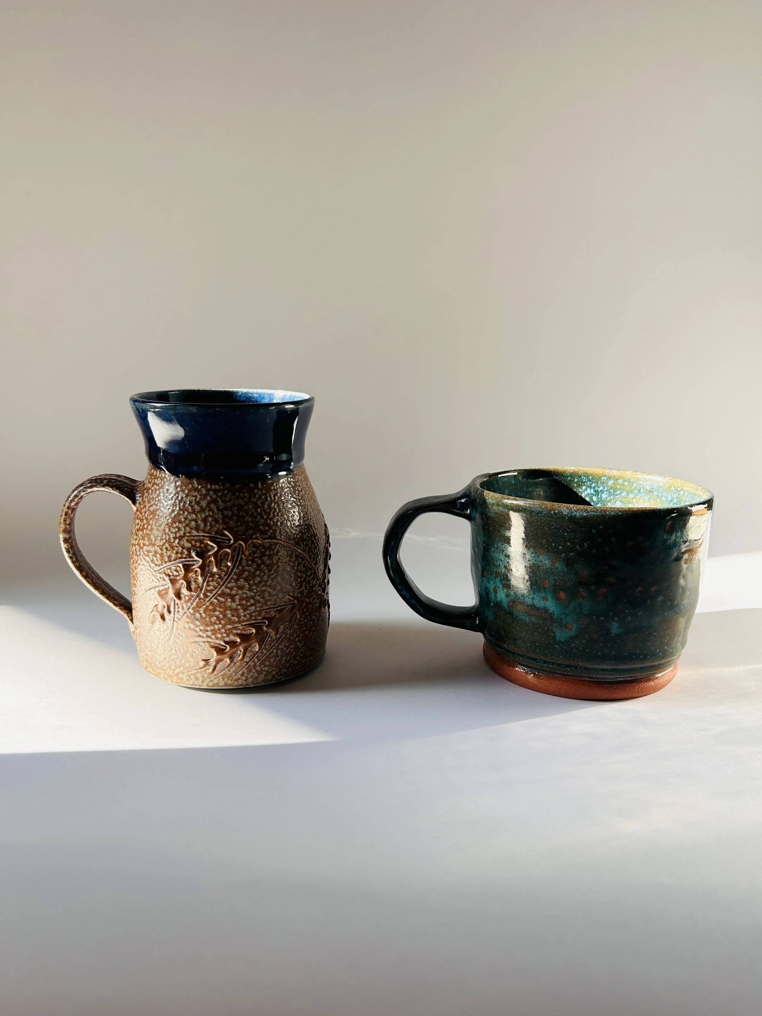 handmade ceramic mug with embossed wheat design and brown to blue glaze