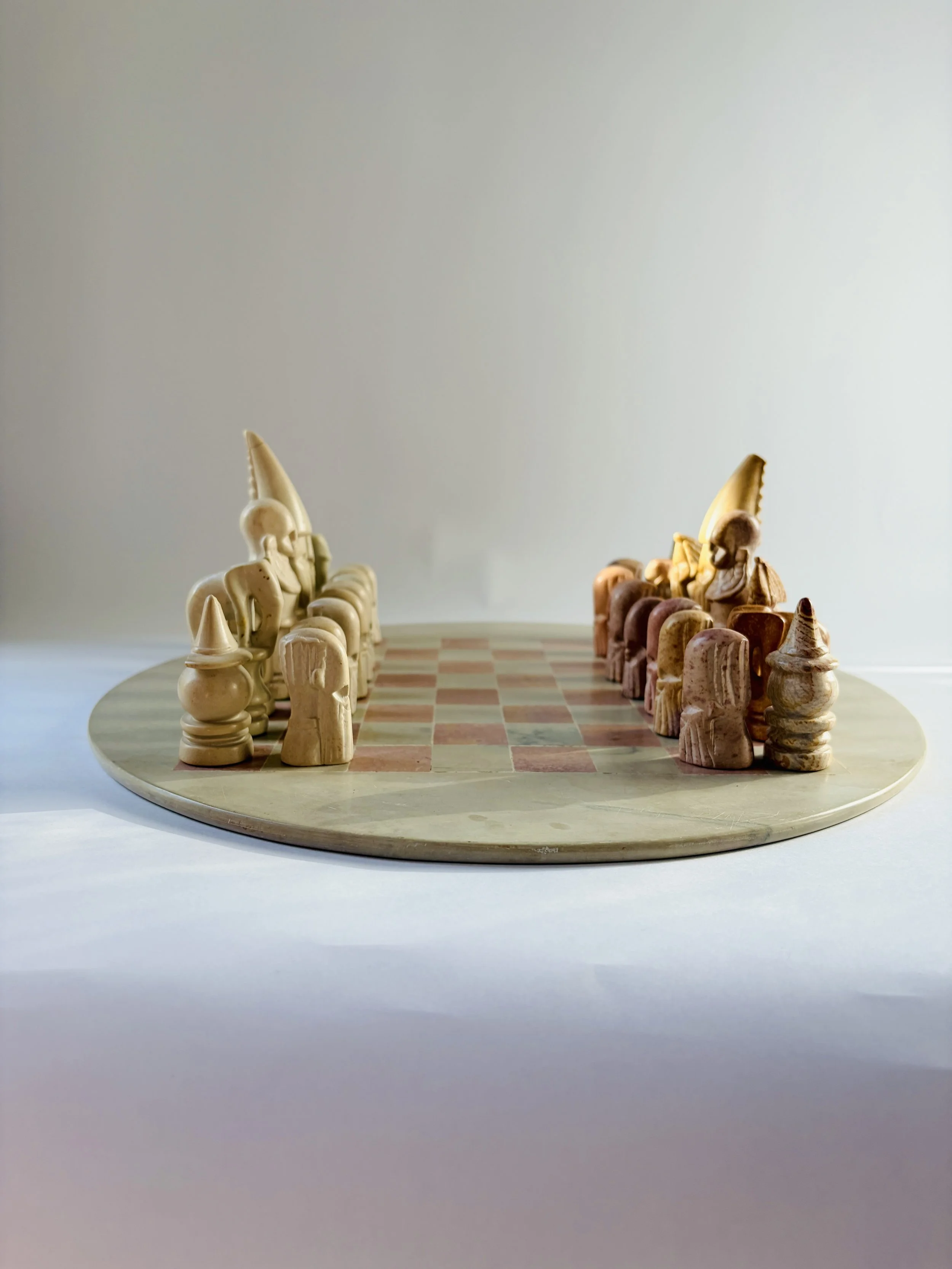 hand carved soapstone chess set with stone board and sculptural pieces