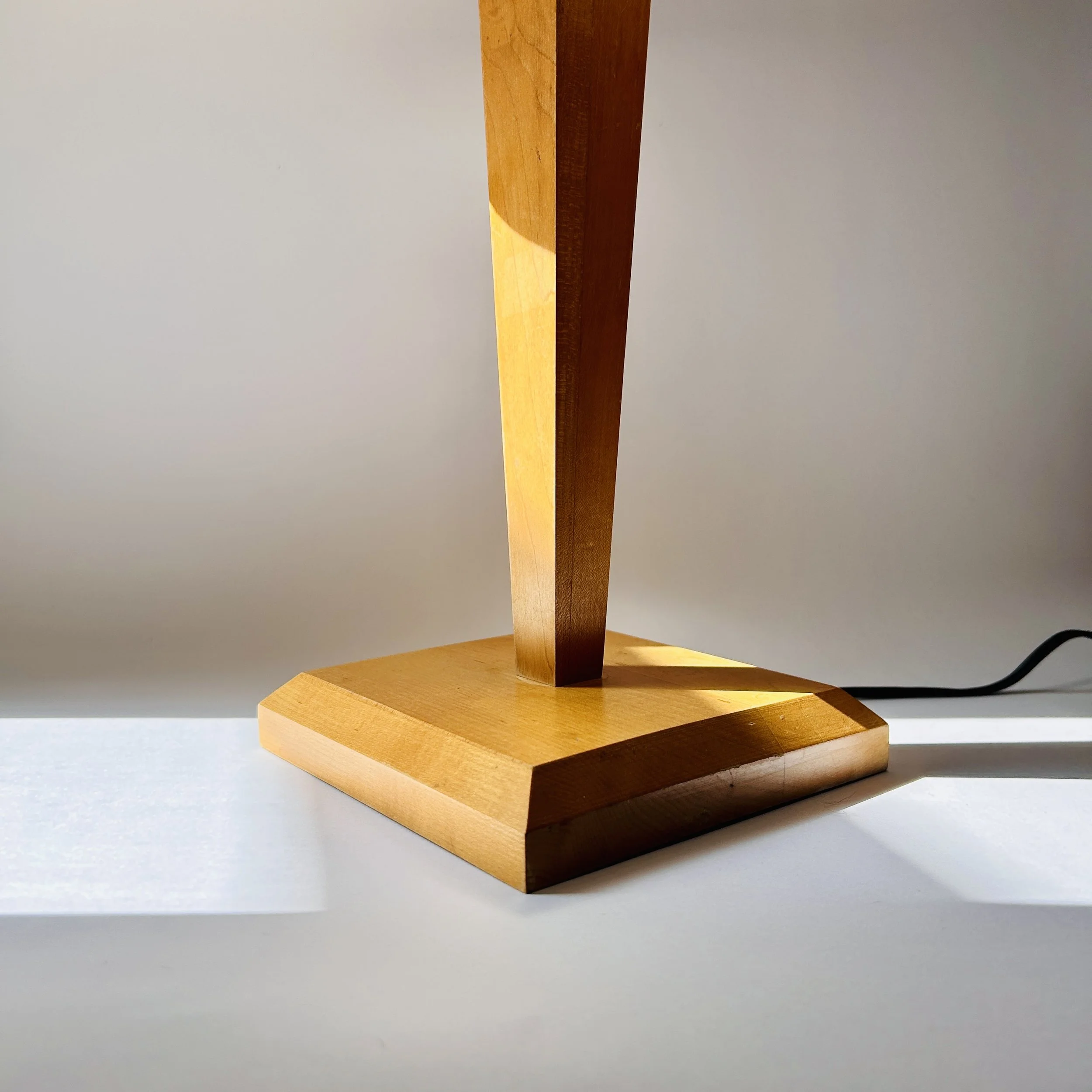 Vintage minimalist wooden table lamp with tapered geometric column, square wood base, and warm ivory raw silk shade.