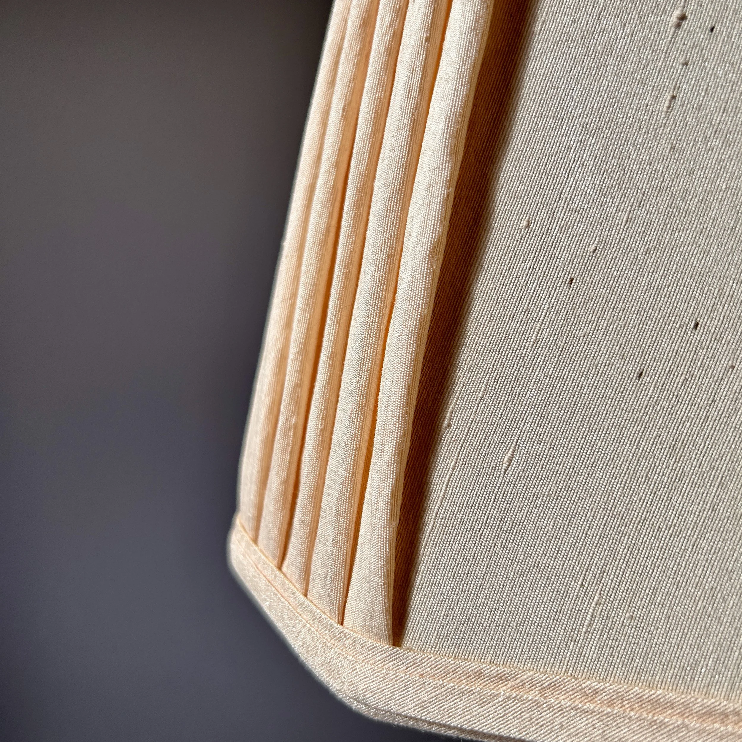Vintage minimalist wooden table lamp with tapered geometric column, square wood base, and warm ivory raw silk shade.
