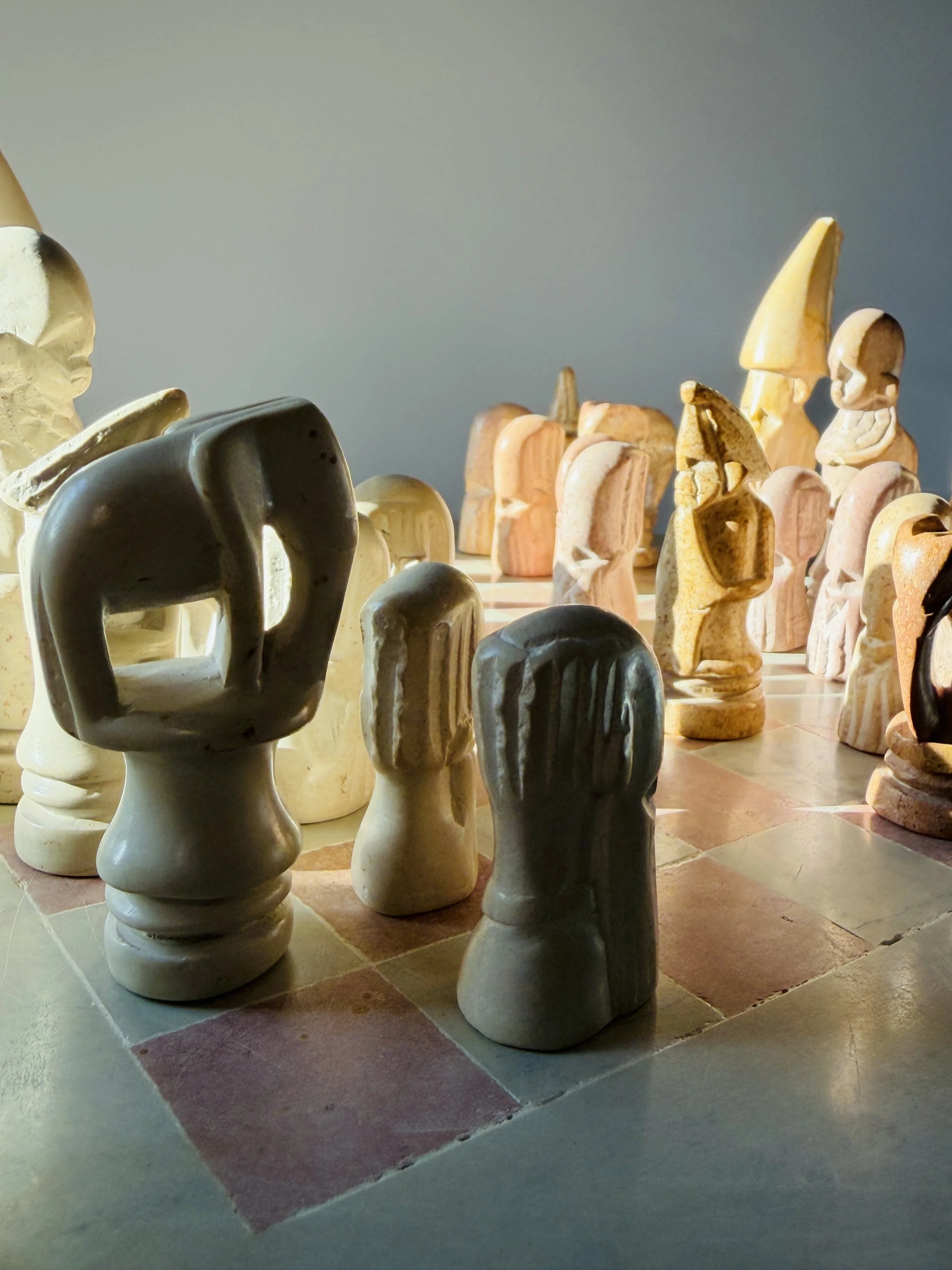 hand carved soapstone chess set with stone board and sculptural pieces