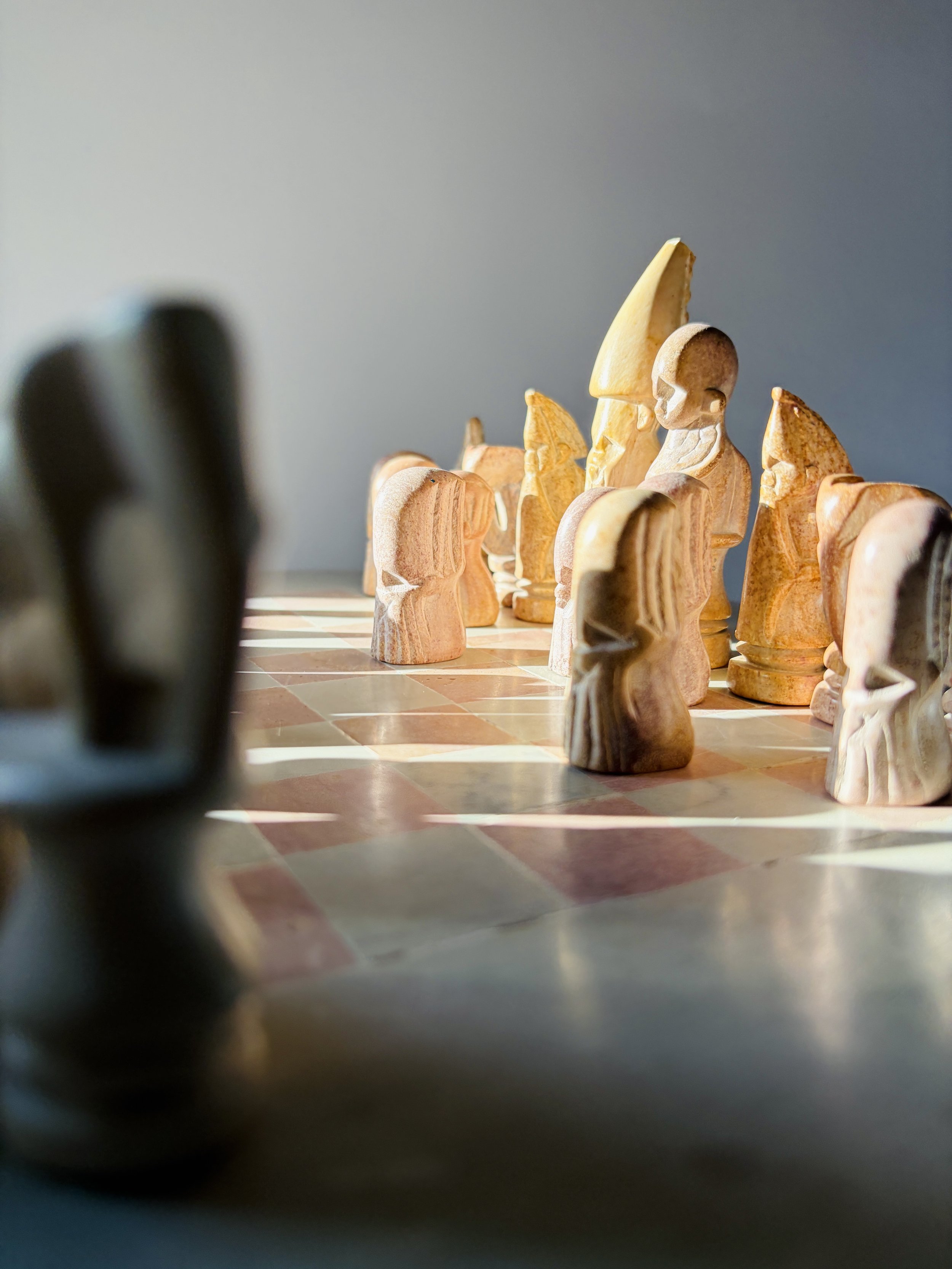 hand carved soapstone chess set with stone board and sculptural pieces