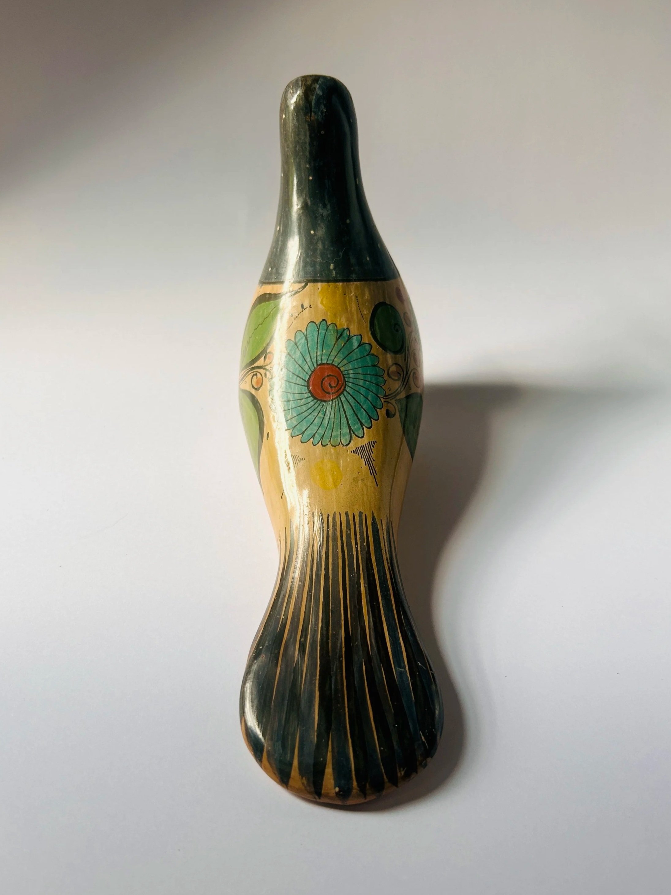 Vintage hand-painted ceramic bird figurine with Mexican floral folk art design, decorative Tonala dove sculpture