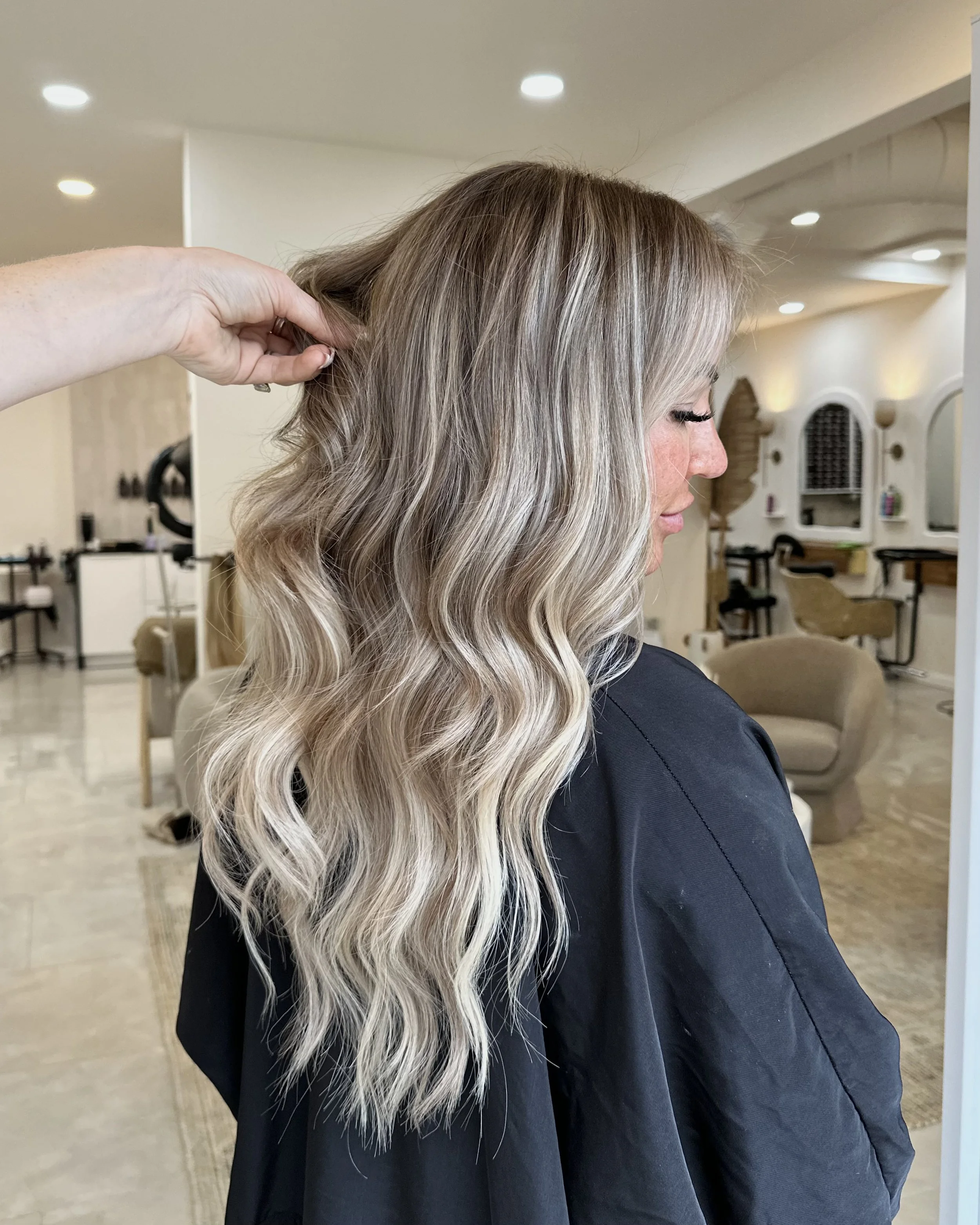 Luxury blonde hair extensions with dimensional color and seamless blending at GROW Hair Lounge in Atlanta.