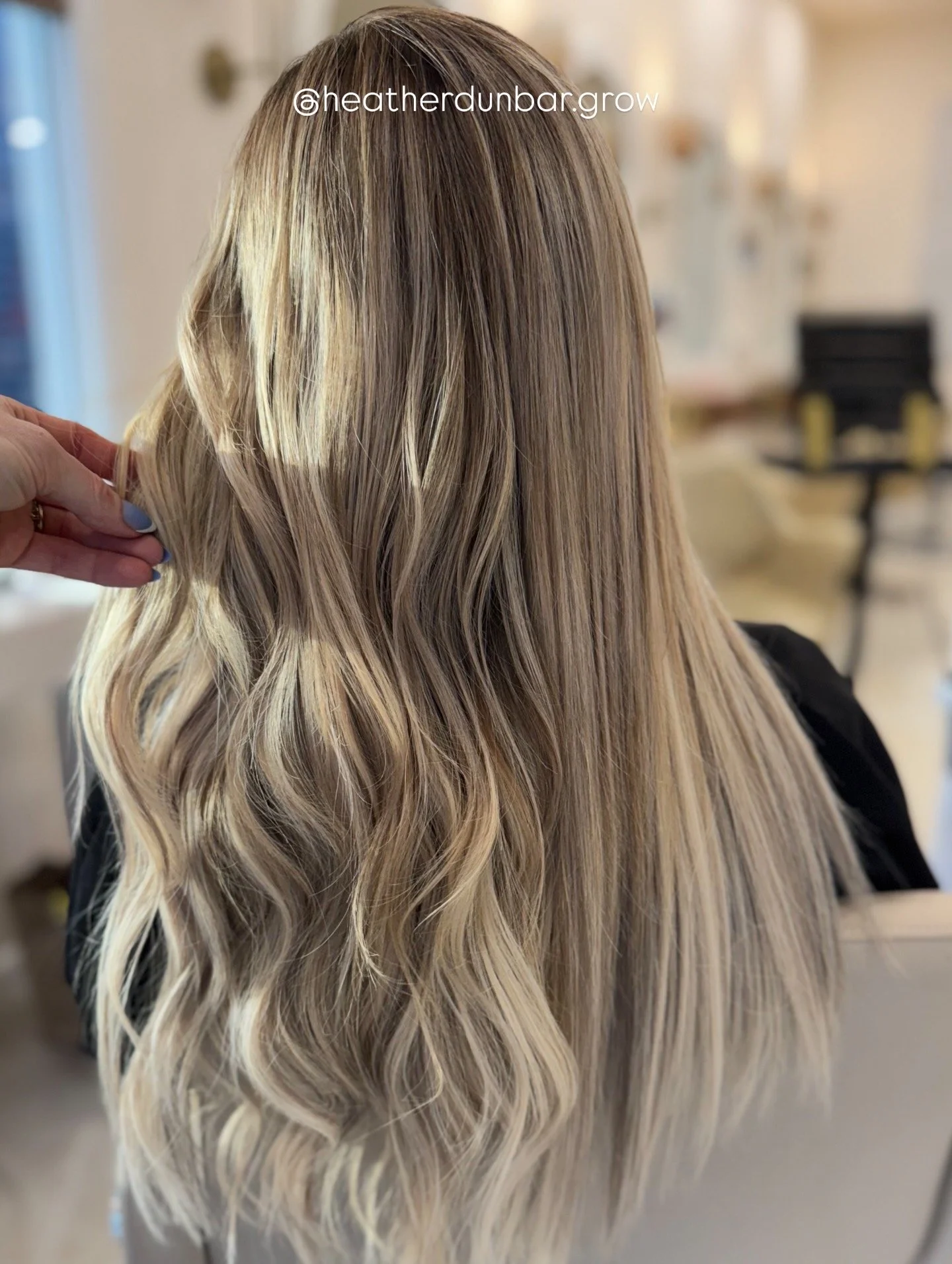 Luxury hair extensions with seamless blonde blending at GROW Hair Lounge in Atlanta.