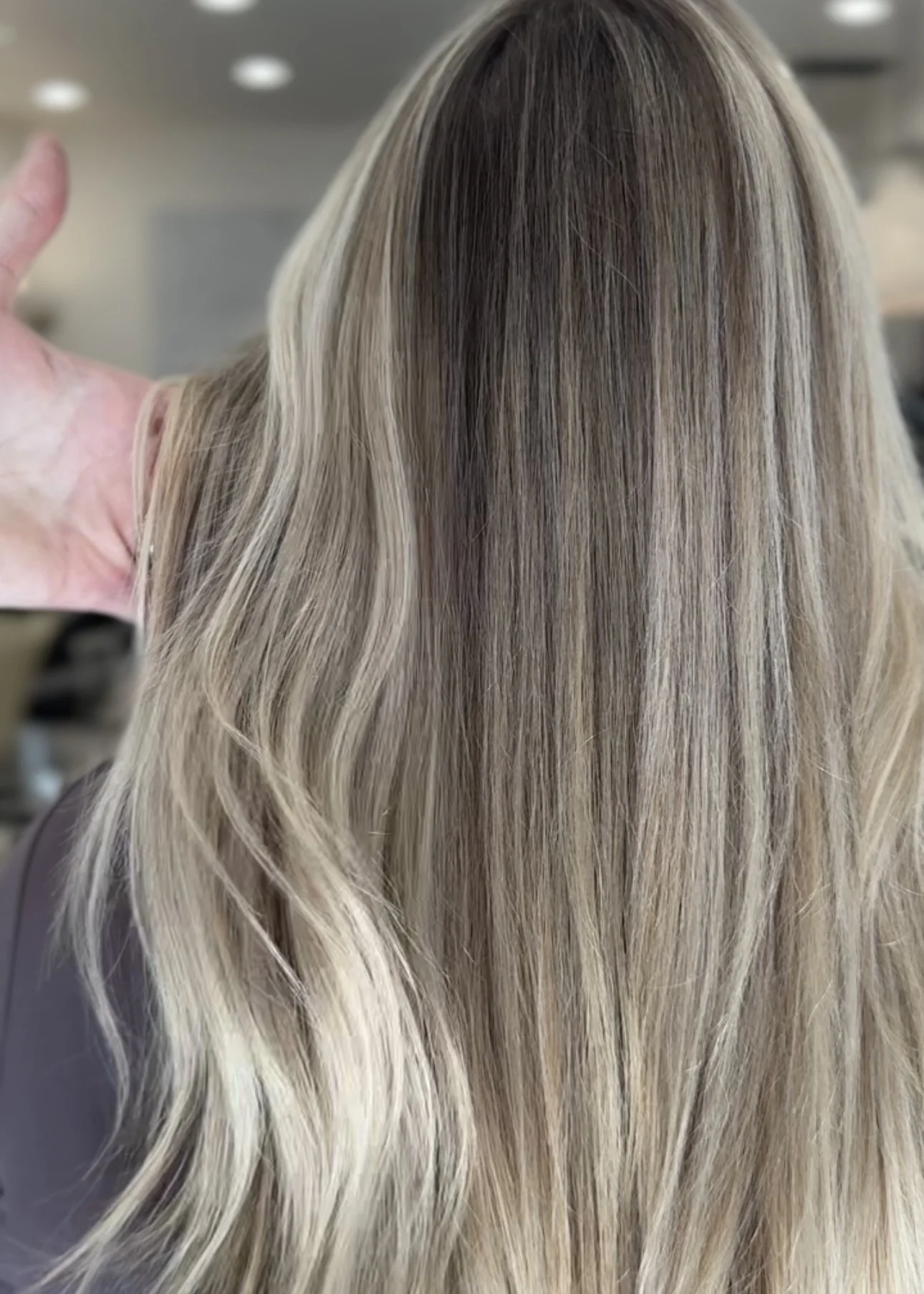 Luxury blonde hair color with dimensional highlights and seamless extension blending at GROW Hair Lounge in Atlanta.