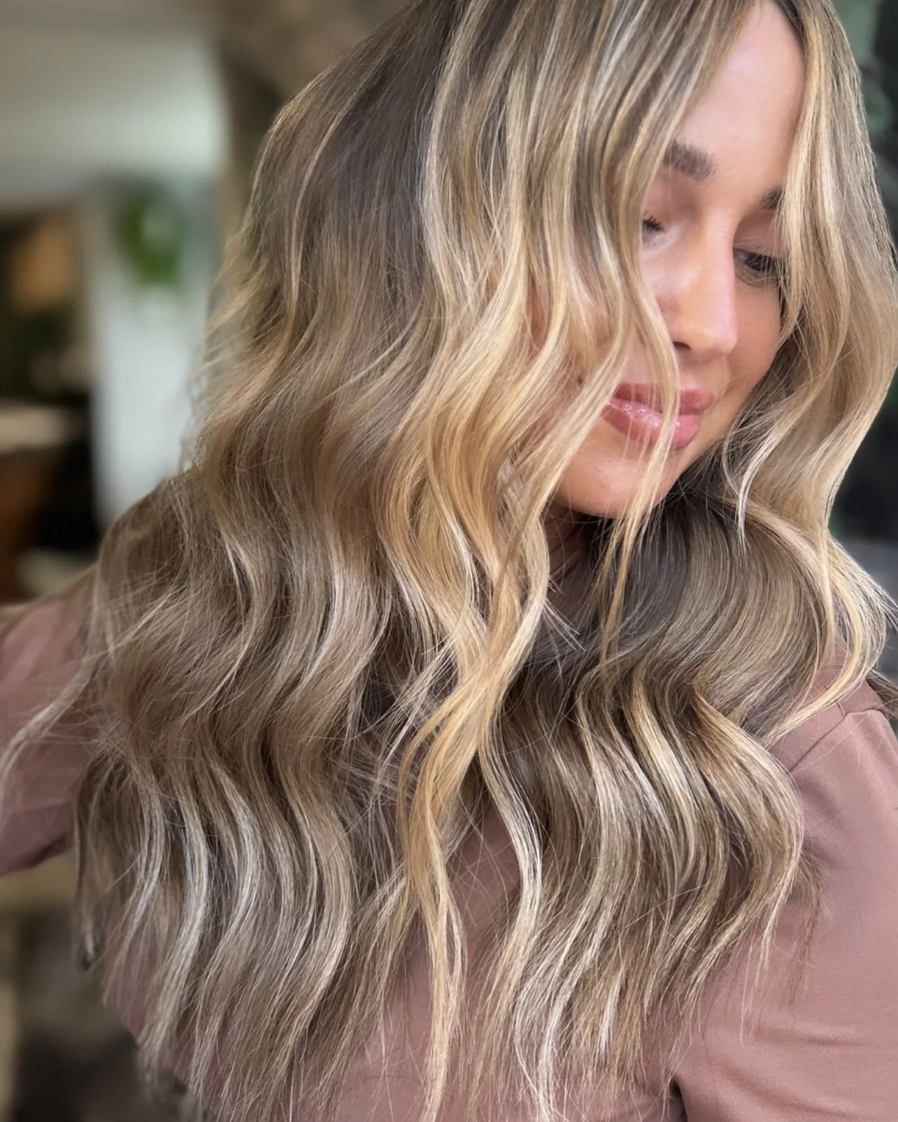 Luxury blonde hair extensions customized for natural movement and dimension.