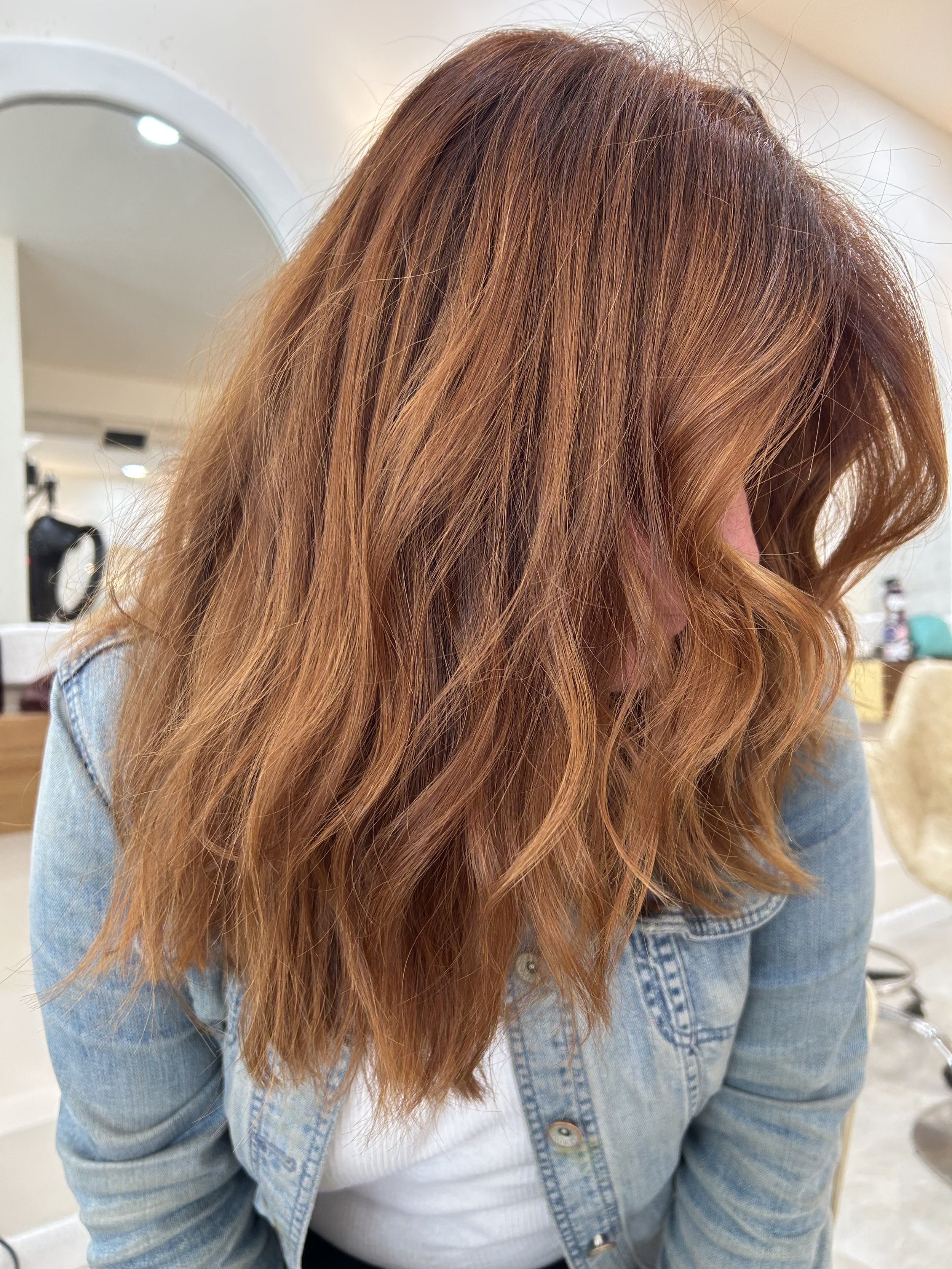 Copper hair color and luxury hair extensions at GROW Hair Lounge in Atlanta.