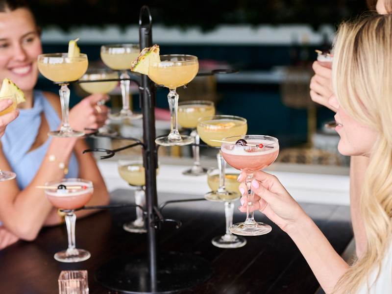 Group of women enjoying cocktails at a bar