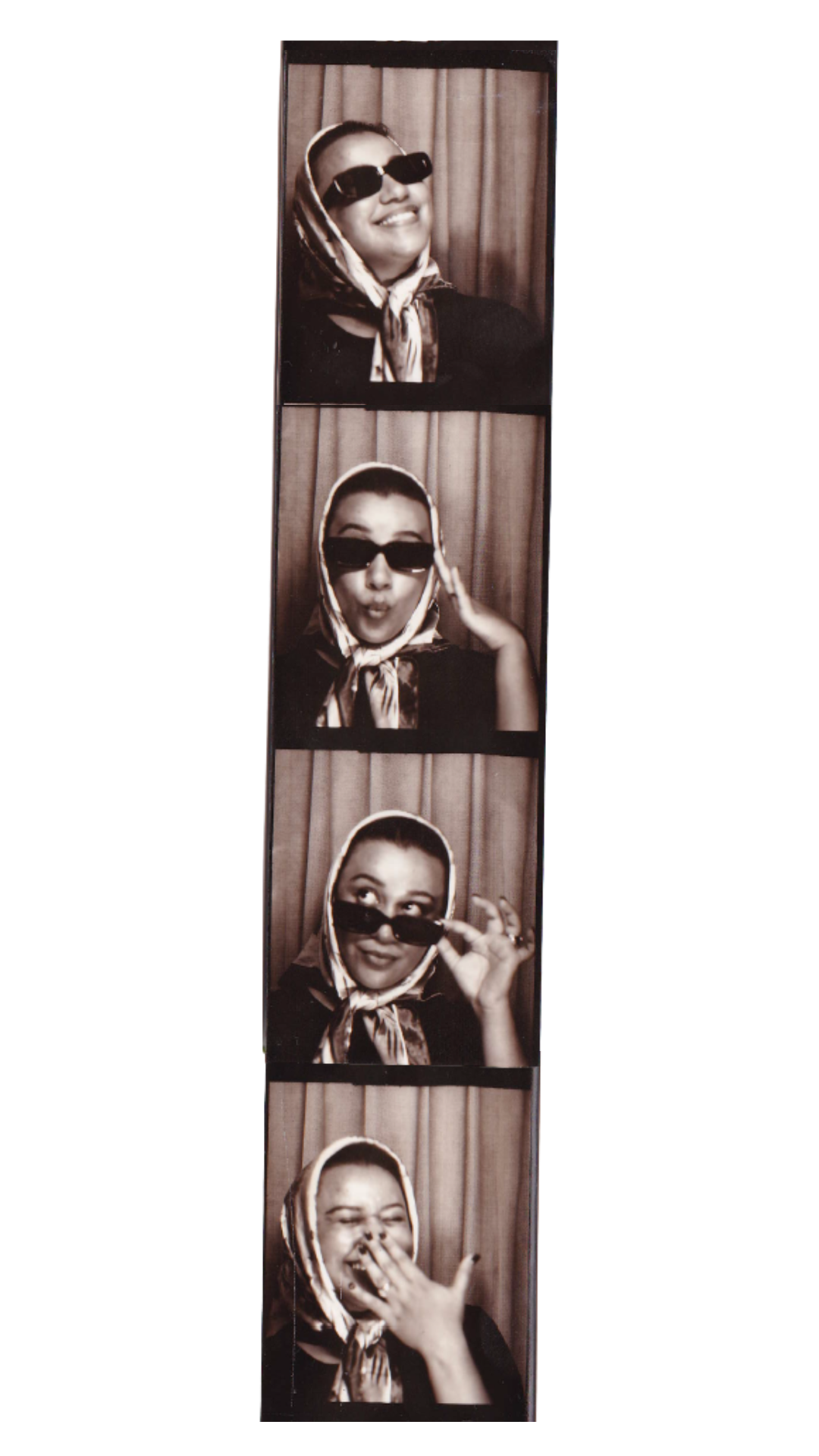 A strip of four black-and-white photo booth pictures of a woman with a headscarf and sunglasses, showing different facial expressions and gestures against a curtain background.