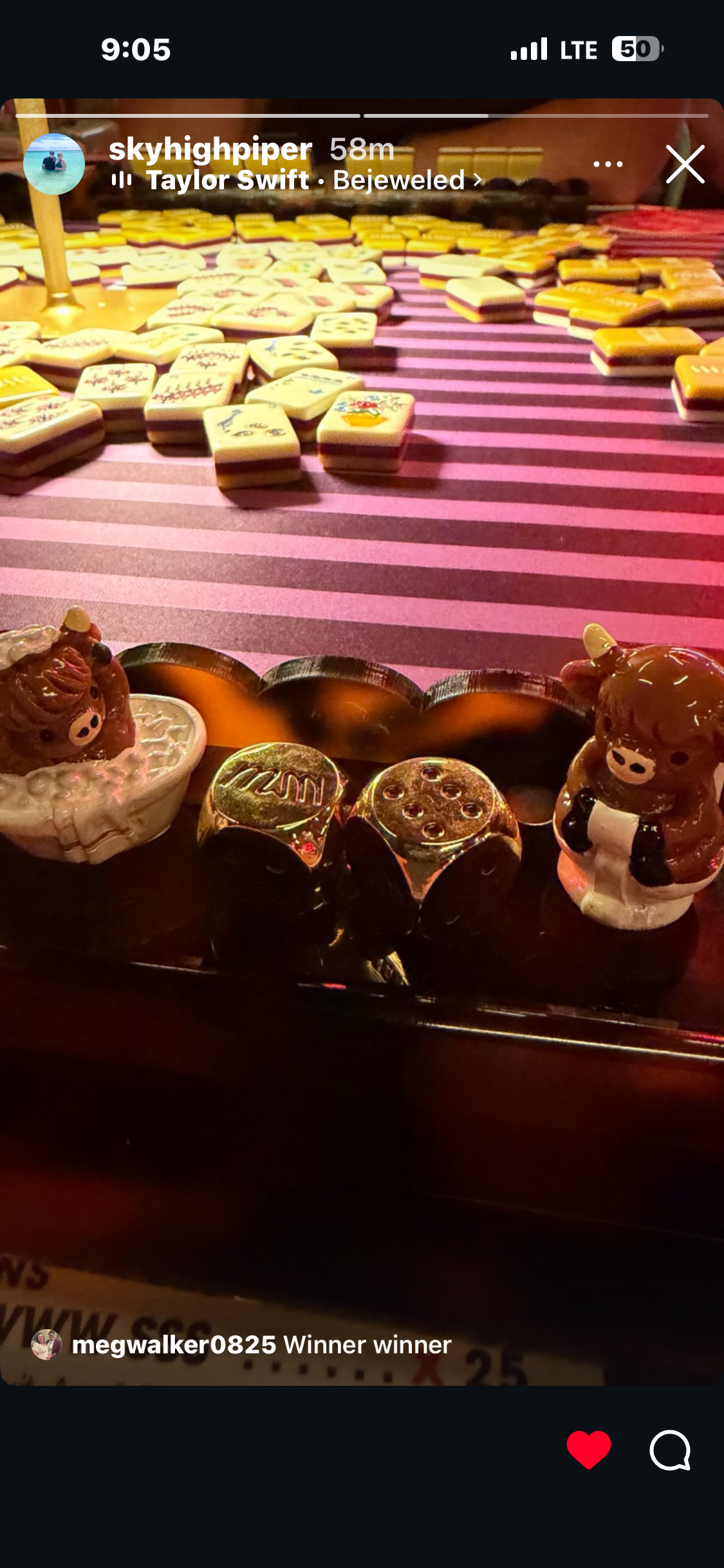 Close-up of decorative cow-shaped salt and pepper shakers and small gold containers, with a background of colorful patterned tiles, on a dining table.