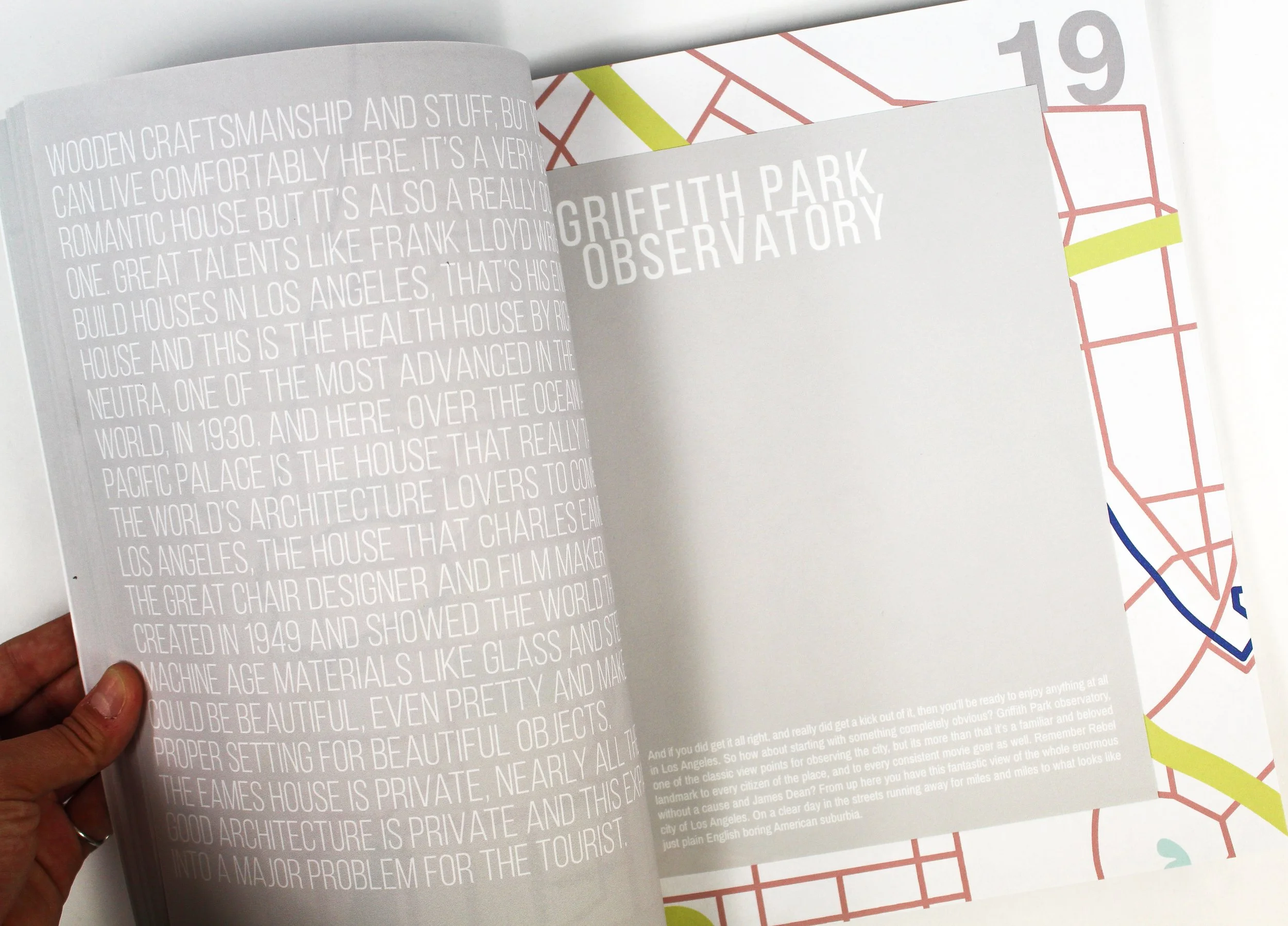 Open book showing text about Griffith Park Observatory and a partial map of Los Angeles with areas marked in different colors.