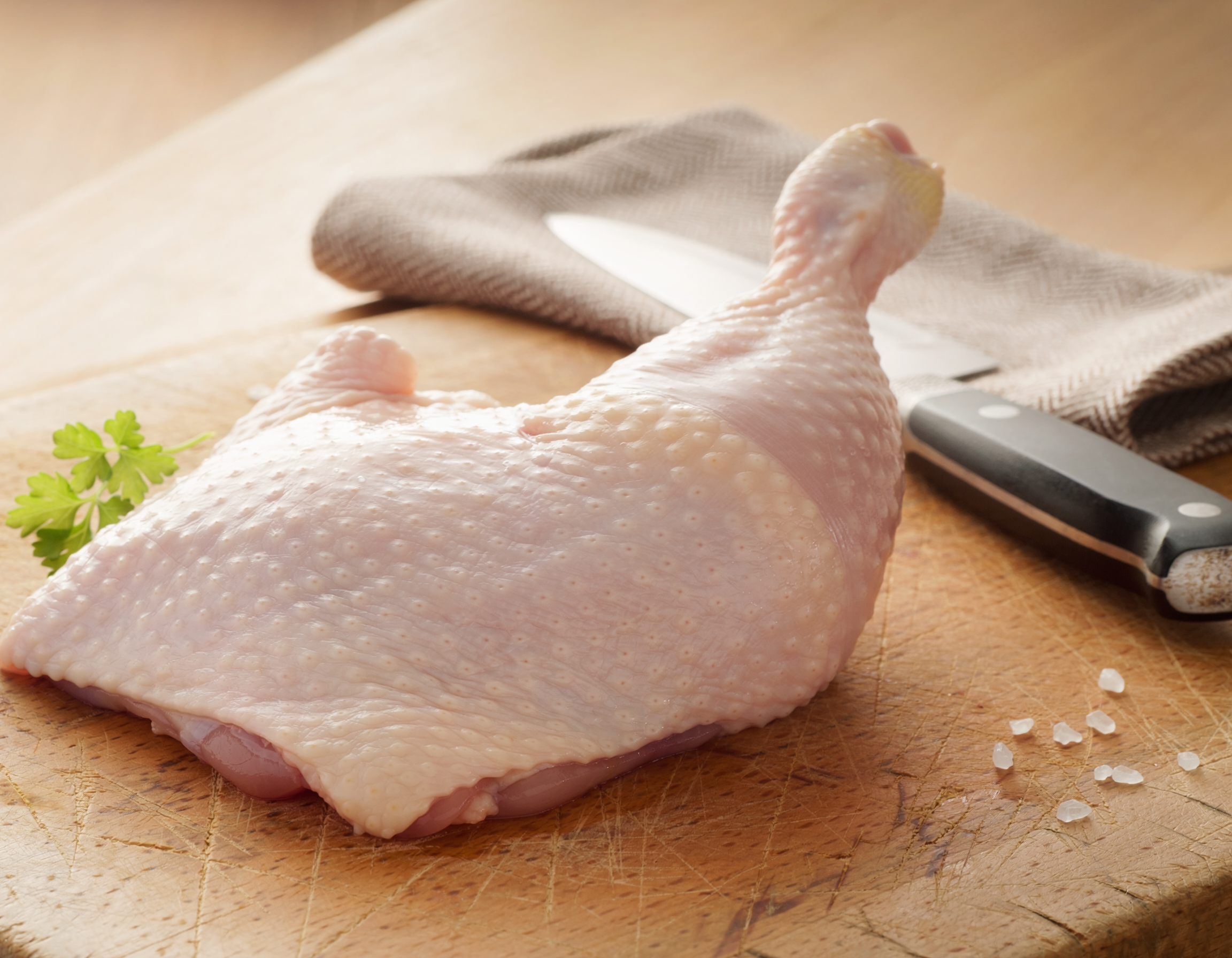 Firefly_fresh butchered whole chicken leg on a table 147004.png