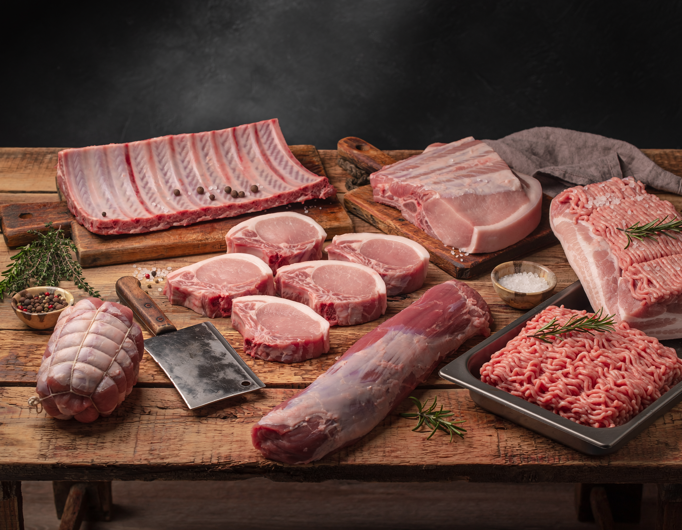 Firefly_fresh butchered pork all cuts on a table 147004.png