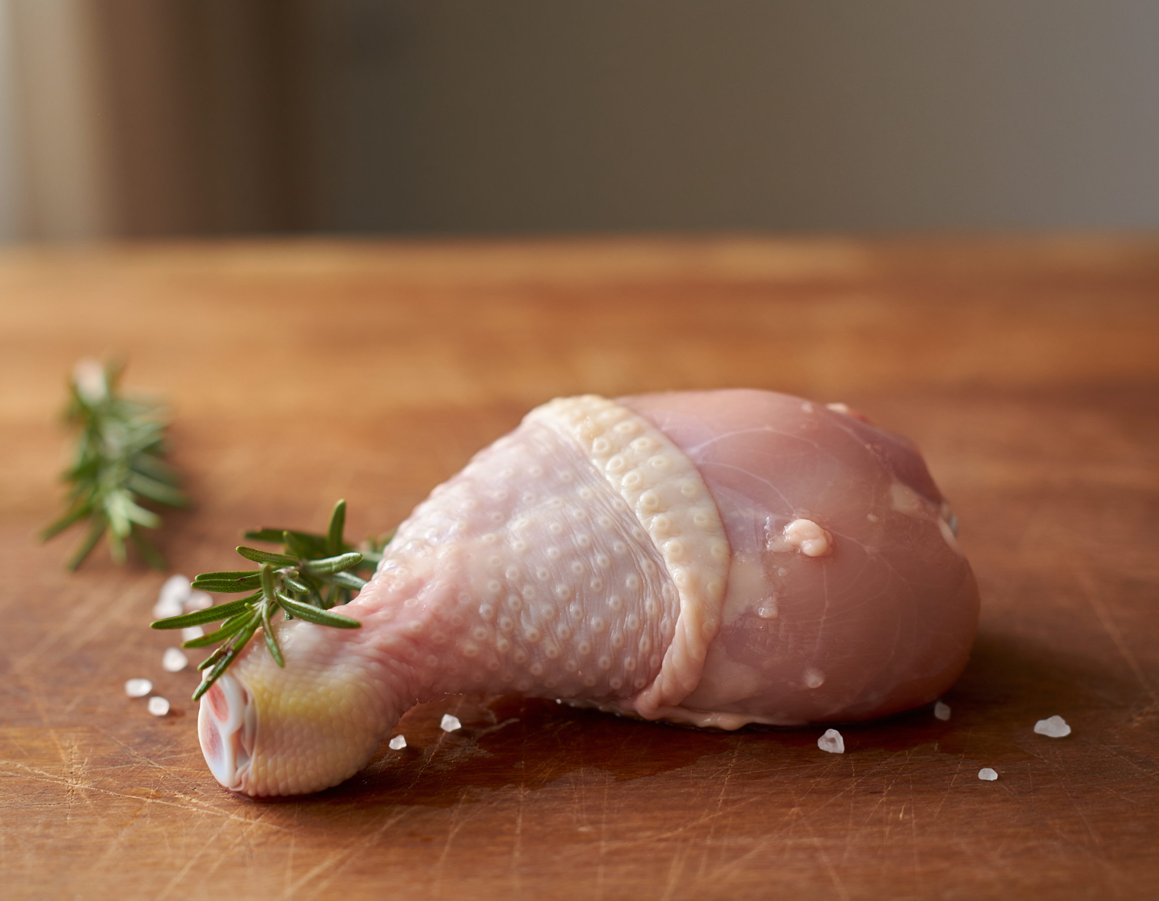 Firefly_fresh butchered chicken drumstick on a table 147004.png