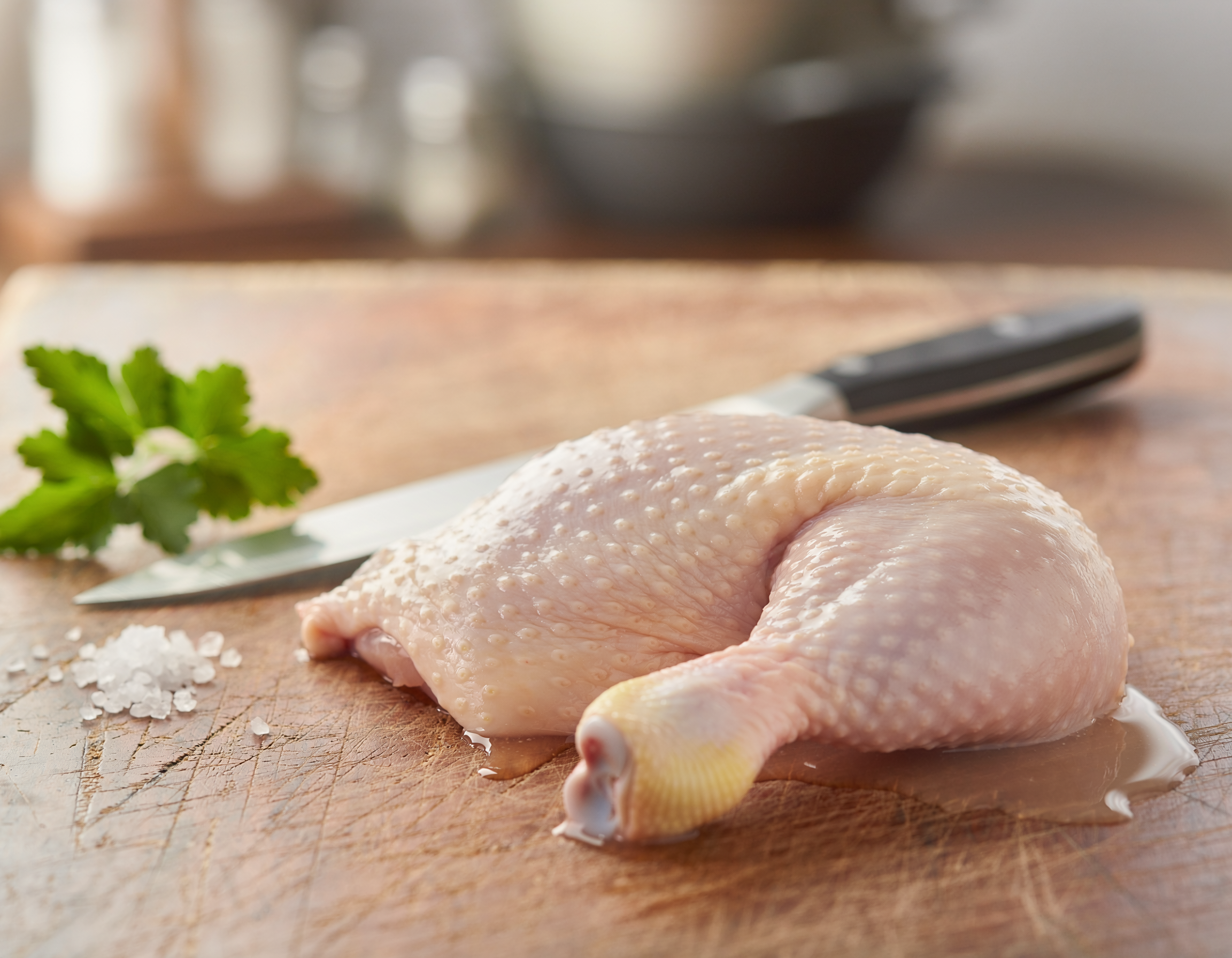 Firefly_fresh butchered chicken thigh on a table 147004.png