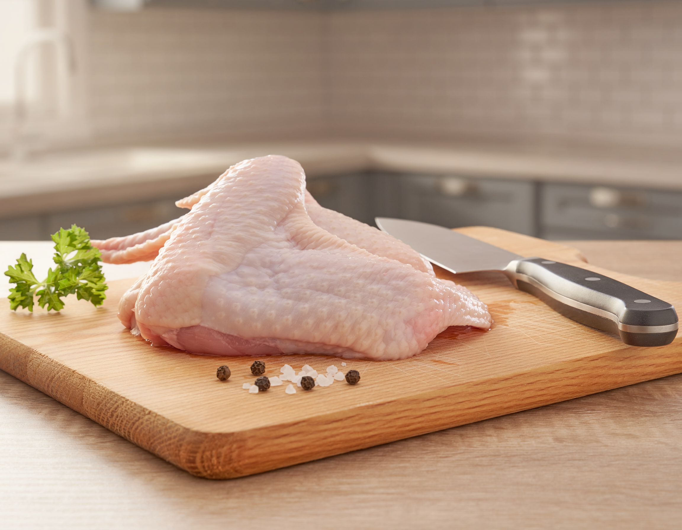 Firefly_fresh butchered boneless chicken wing on a table 147004.png