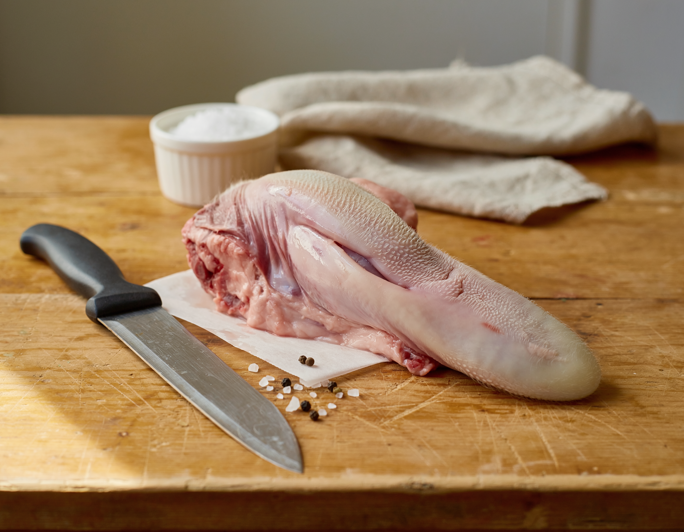 Firefly_fresh butchered lamb tongue on a table 450636.png