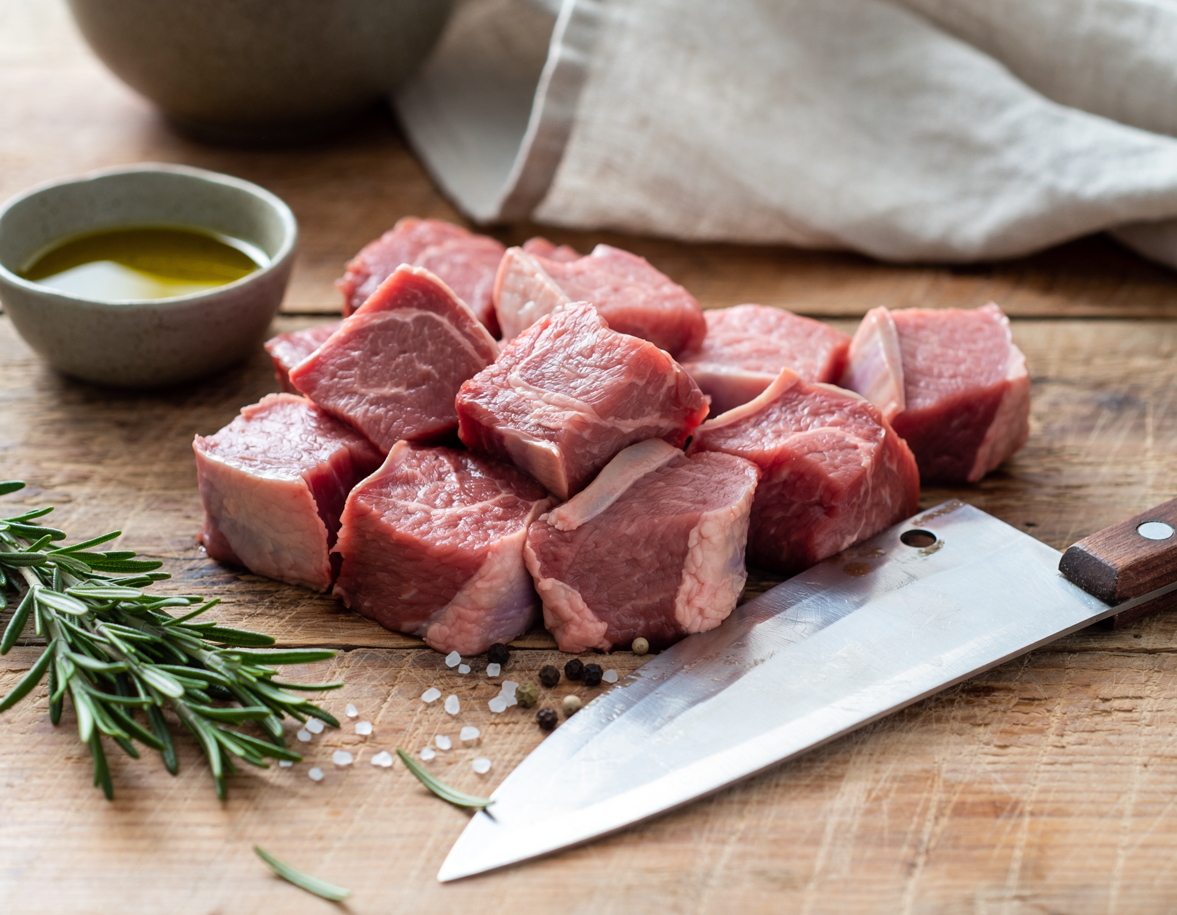 Firefly_fresh butchered lamb stew meat on a table 450636.png