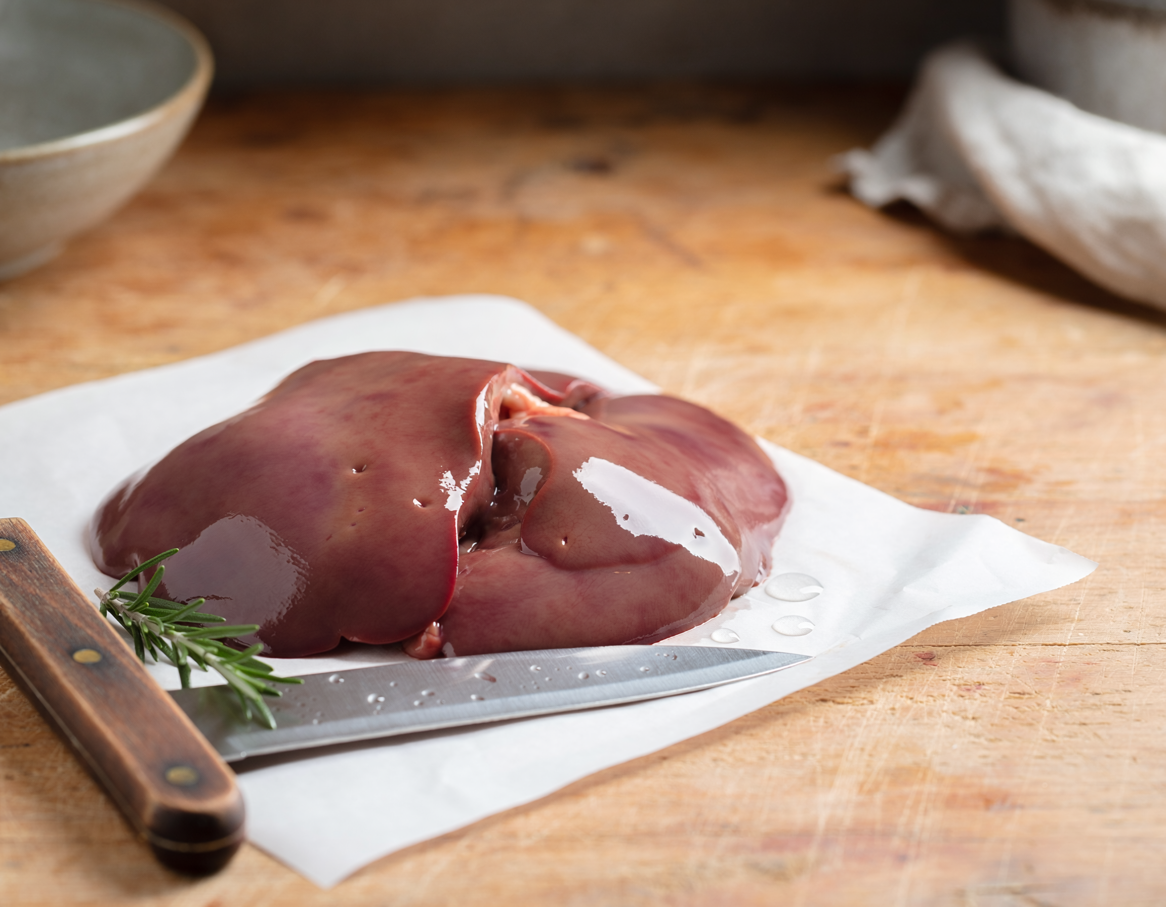 Firefly_fresh butchered lamb liver on a table 450636.png