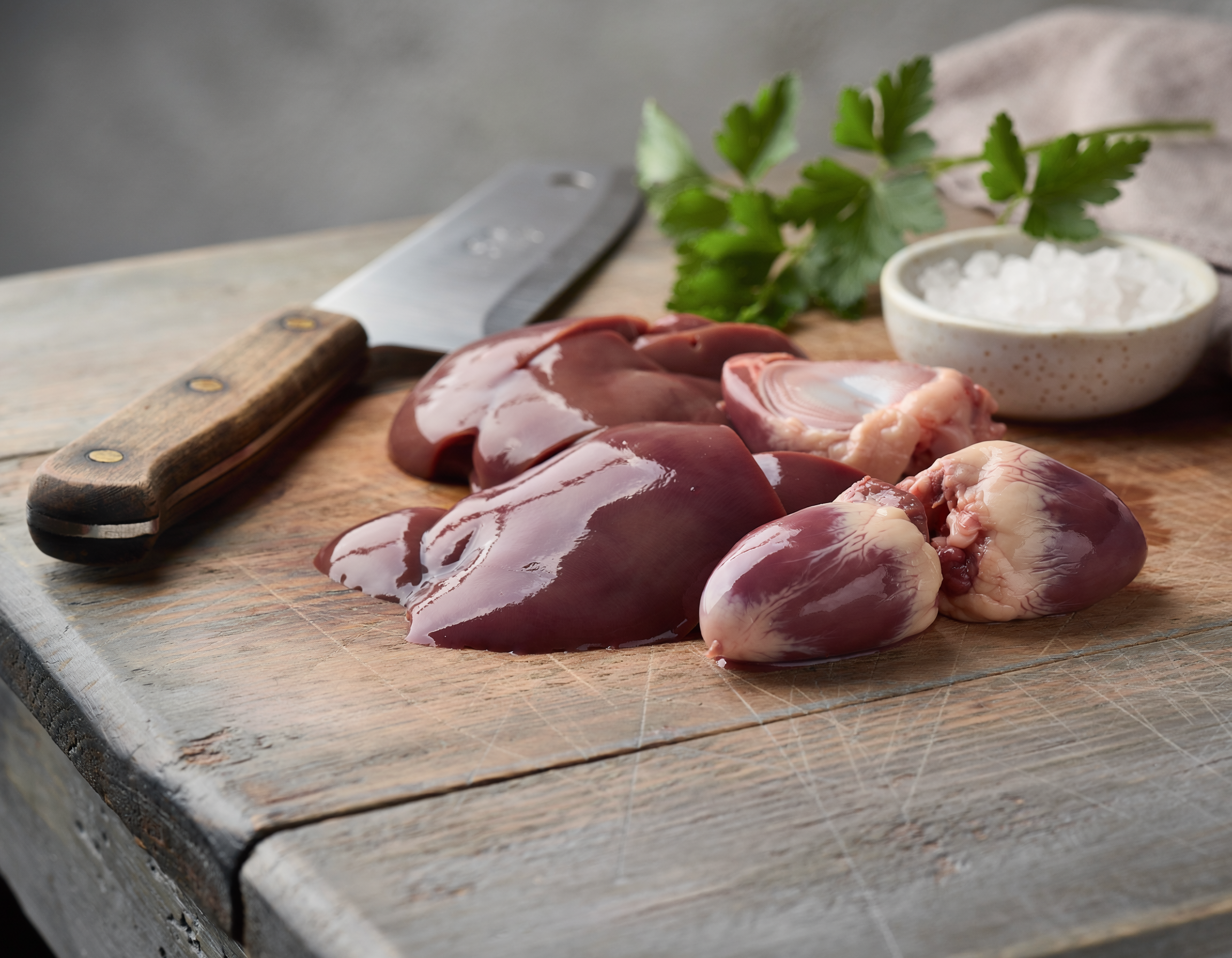 Firefly_fresh butchered chicken giblets on a table 147004.png