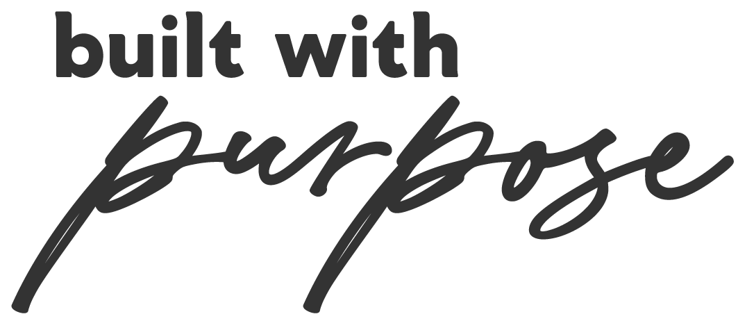 Text that says 'built with purpose' in a stylized font, with 'built with' in bold uppercase and 'purpose' in a handwritten script.