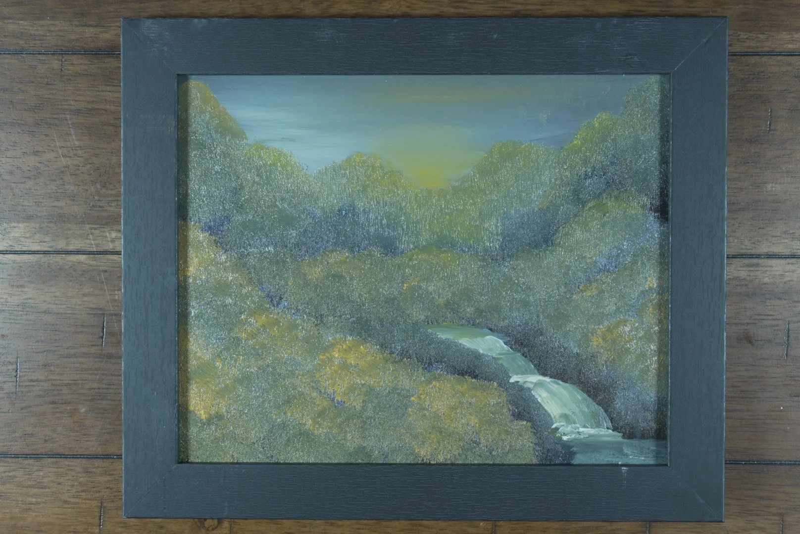 Where the Valley Wakes in a black wood frame